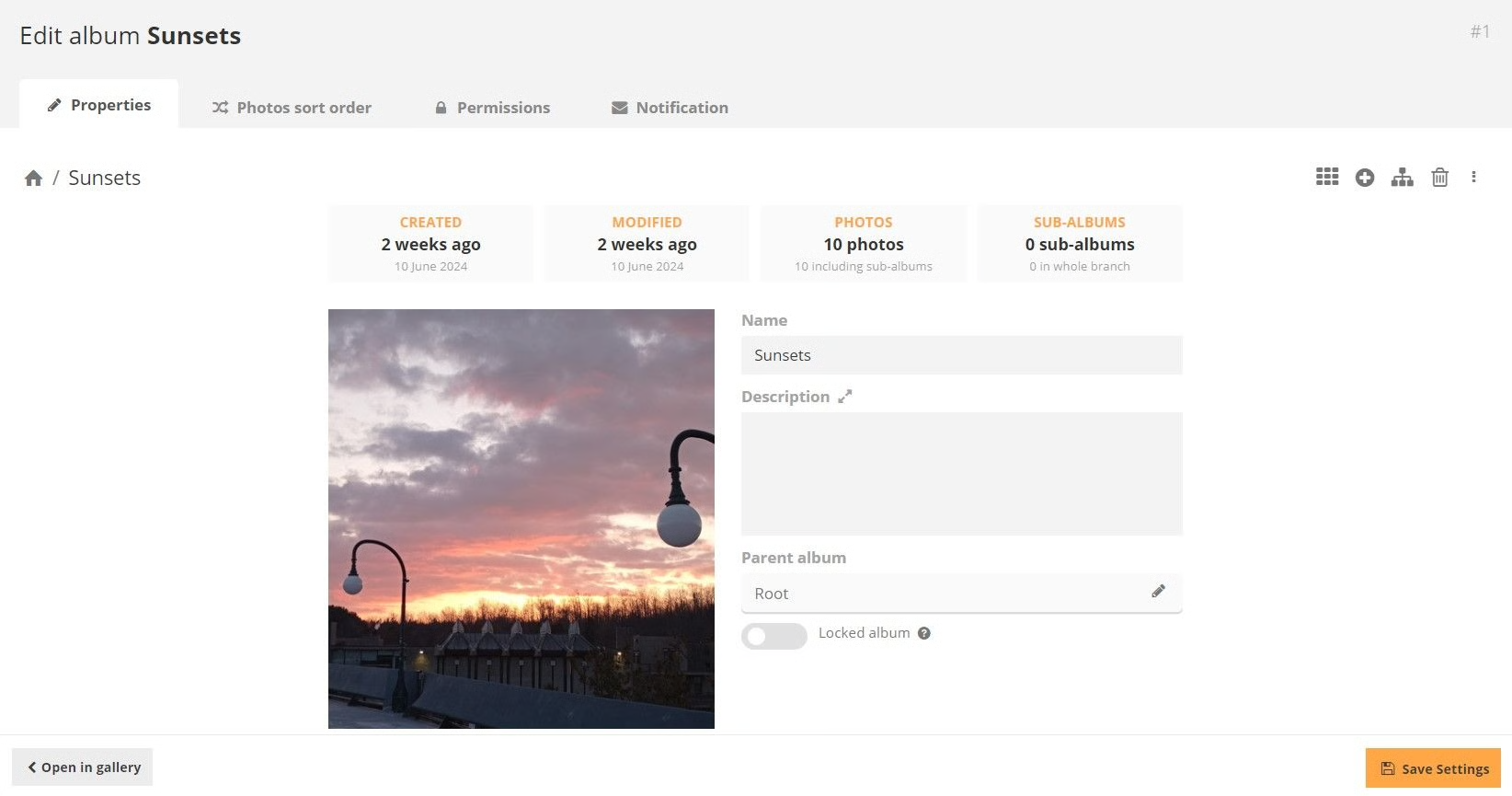 A photograph in an album called “Sunsets” with a form to edit name and description.