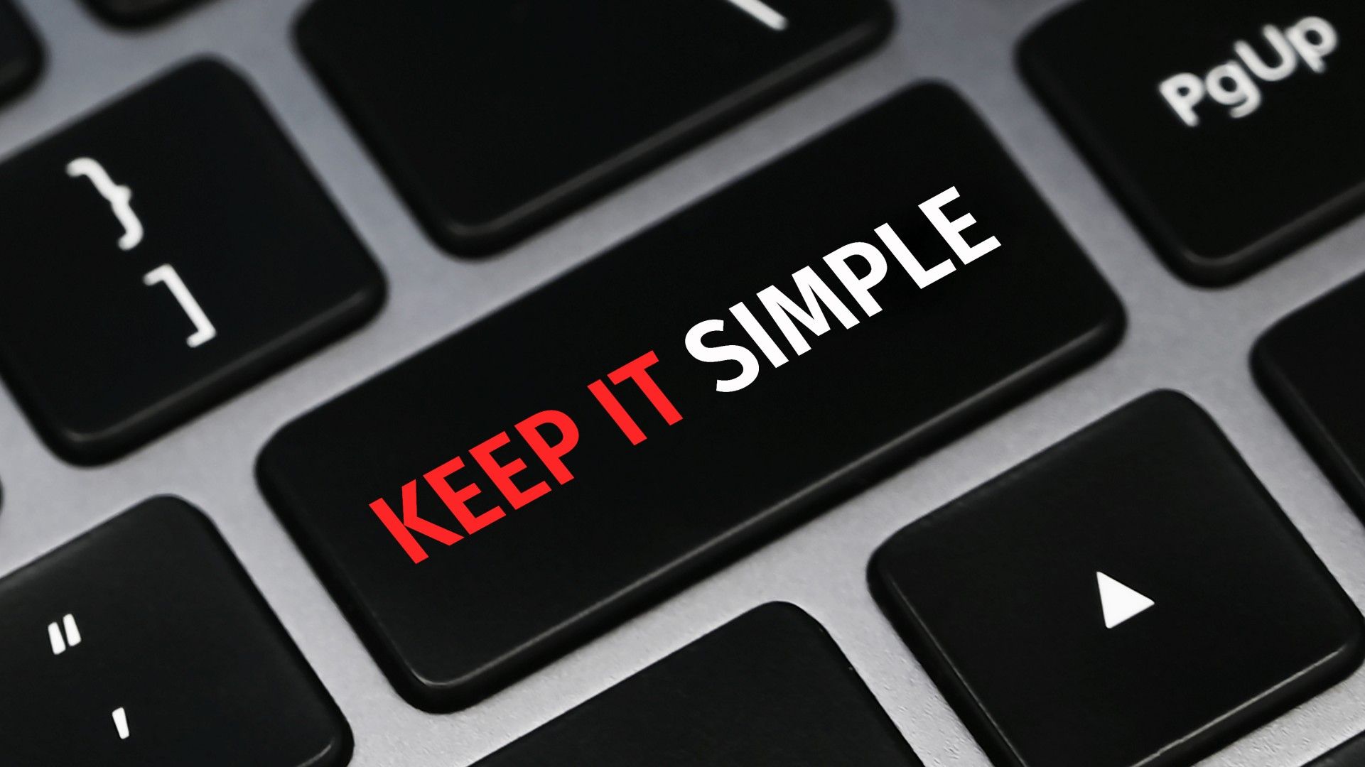 The words "Keep It Simple" on a keyboard button.