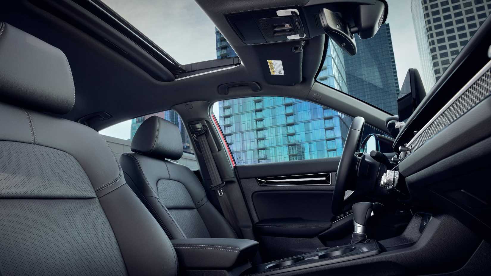 Shot inside the cabin of a Honda Civic Sedan Sport Hybrid 2025 Honda Civic Sport.