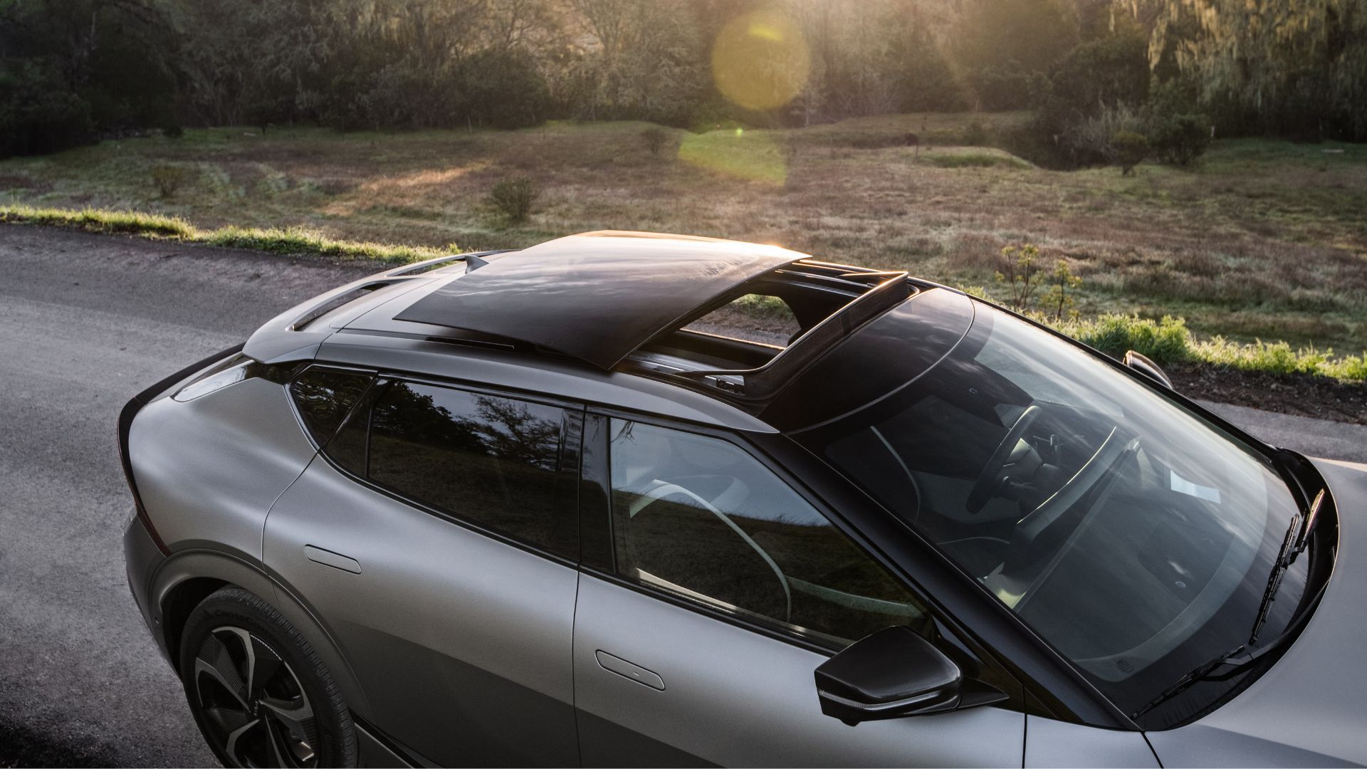 Close-up shot of the sunroof open on a gray 2022 Kia EV6.