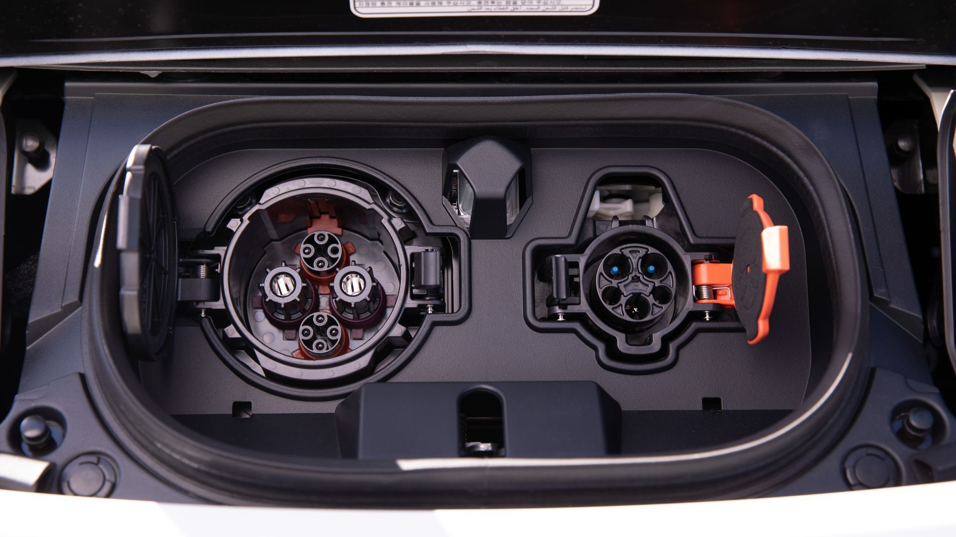 Close-up shot of the charging port on a 2023 Nissan Leaf.