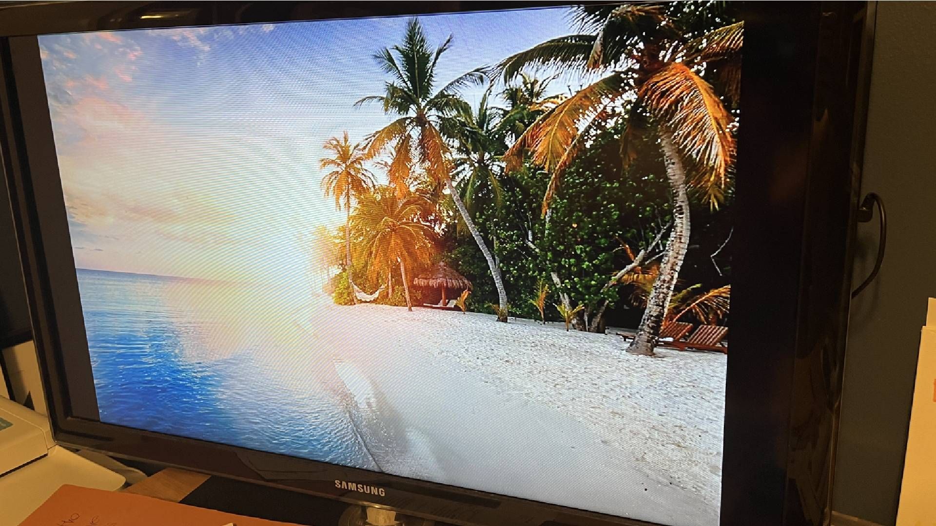 A Samsung "dumb" TV sitting on a desk.