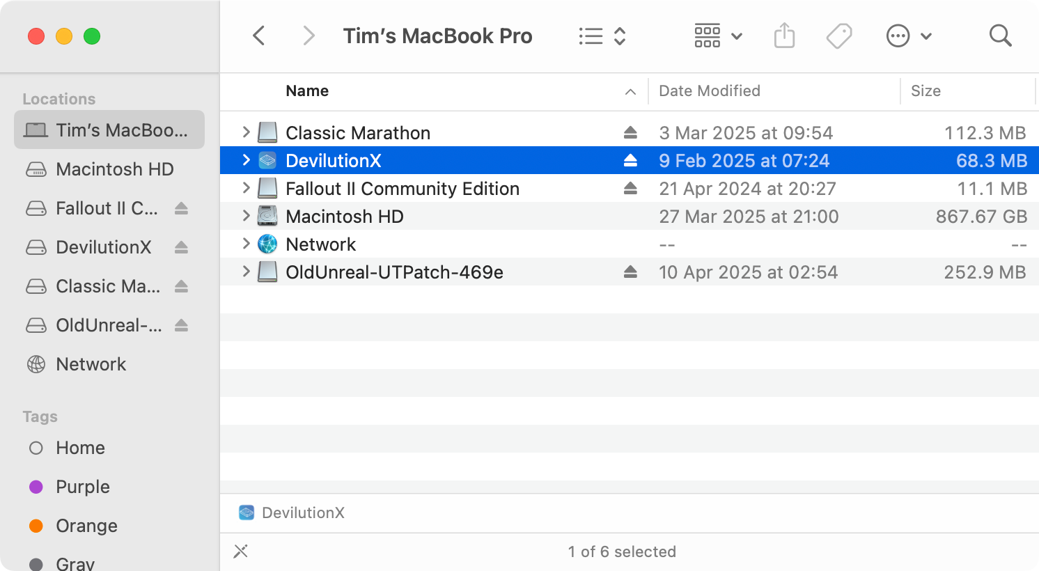 Multiple mounted DMG files in macOS Finder.