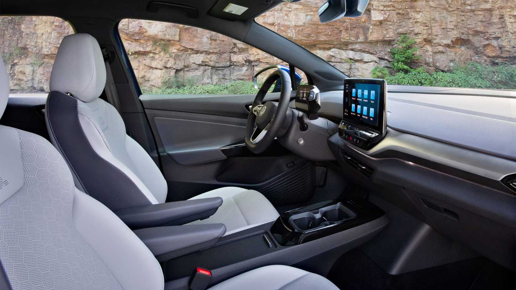 Shot inside the cabin of a 2021 Volkswagen ID.4 showing the front seats and dashboard.