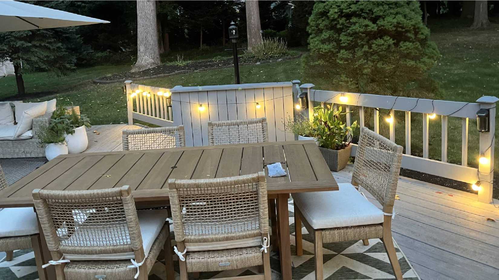 A backyard with Govee Outdoor String Lights 2 set up