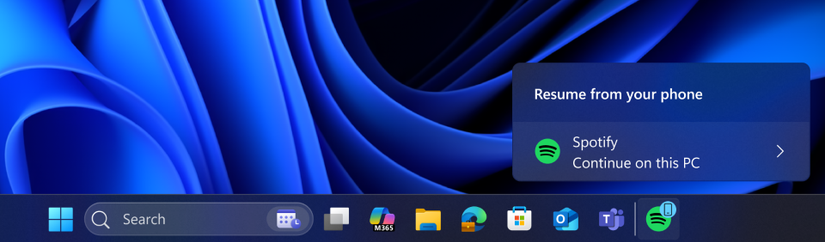A cross-device resume taskbar alert indicating that you can continue using Spotify app from your phone, now on your PC.