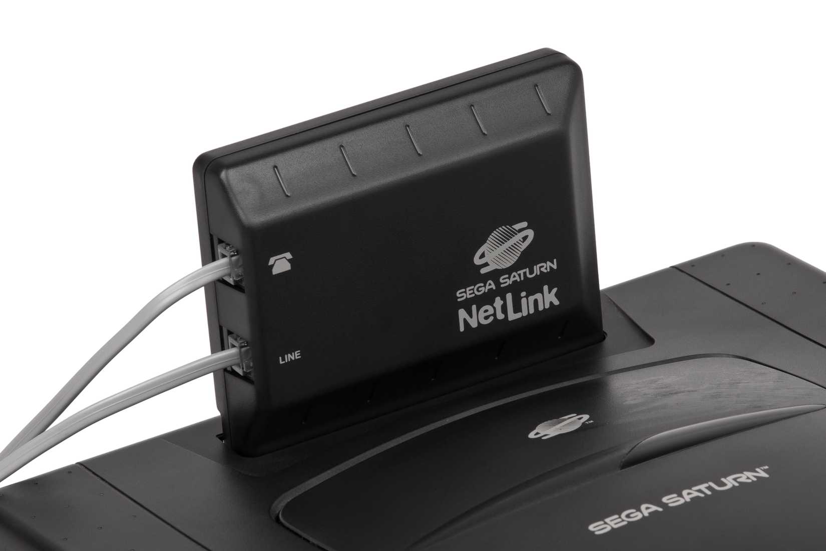 A Netlink adapter connected to a Sega Saturn.