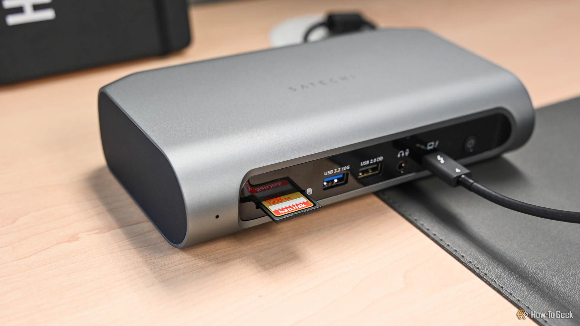 An SD card plugged into the Satechi Thunderbolt 4 Multimedia Pro Dock.