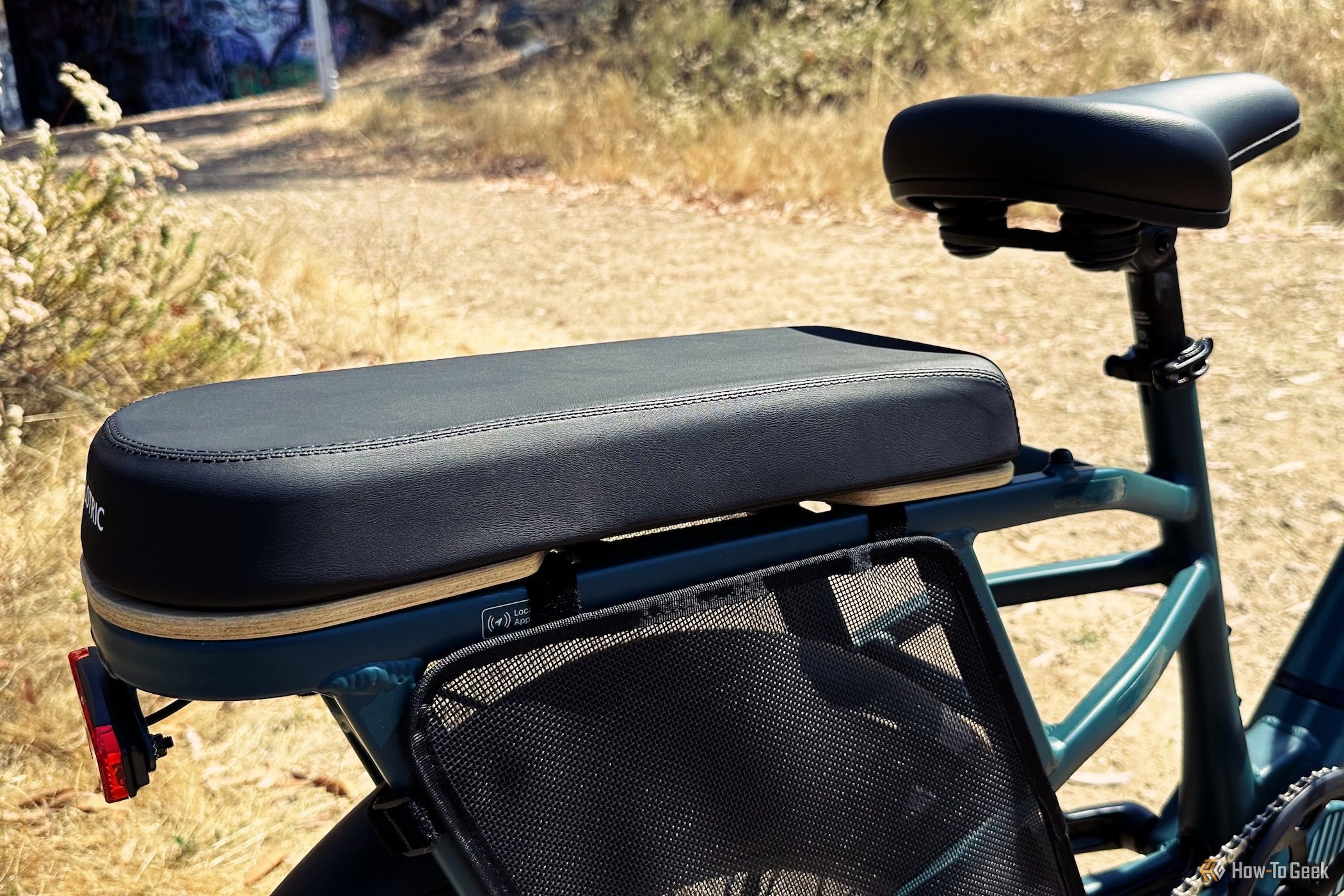Showing the added padded seat to the rear of the Velotric Go 1