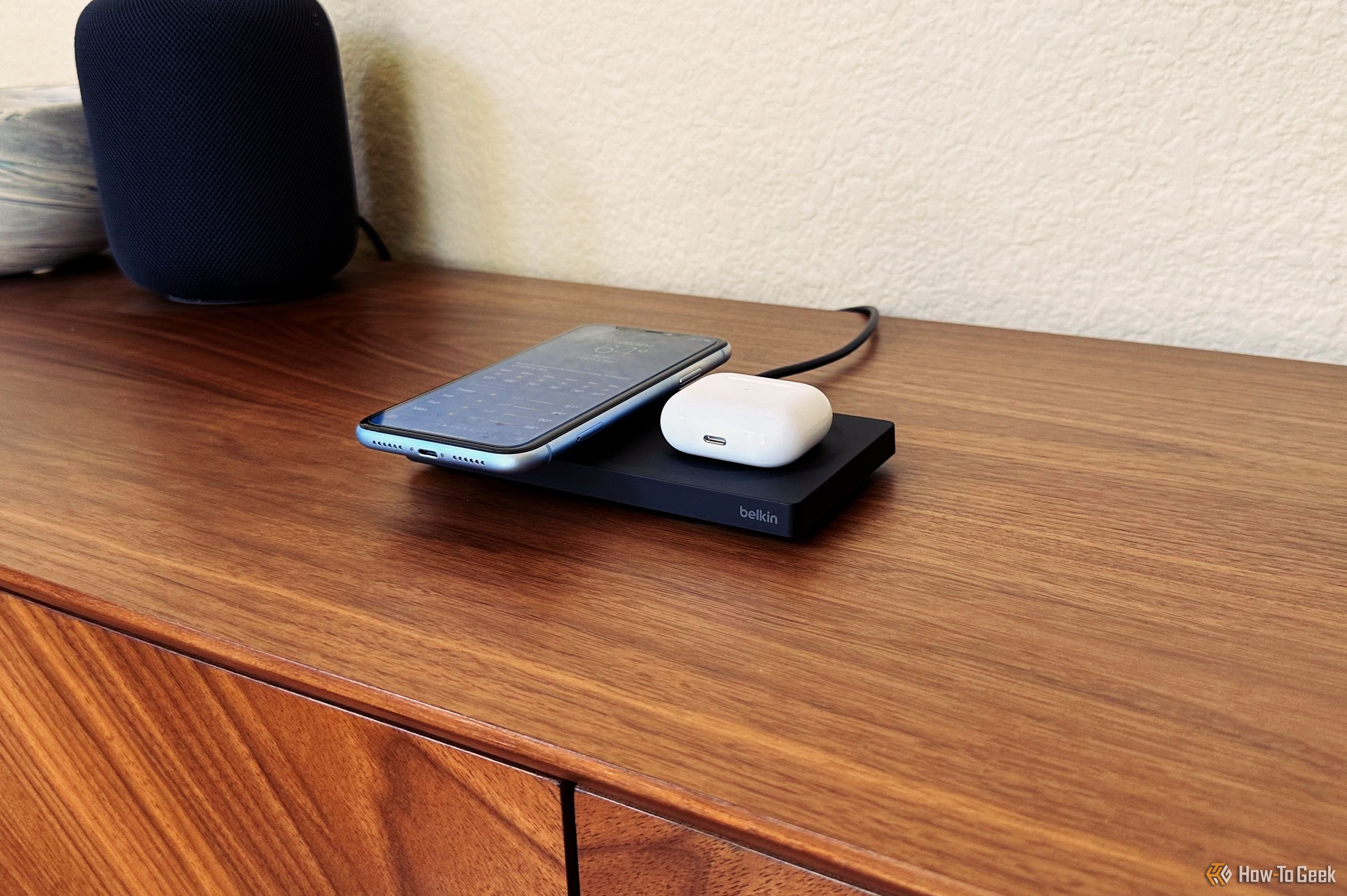 Belkin BoostCharge Pro 2-in-1 charging a phone and AirPods