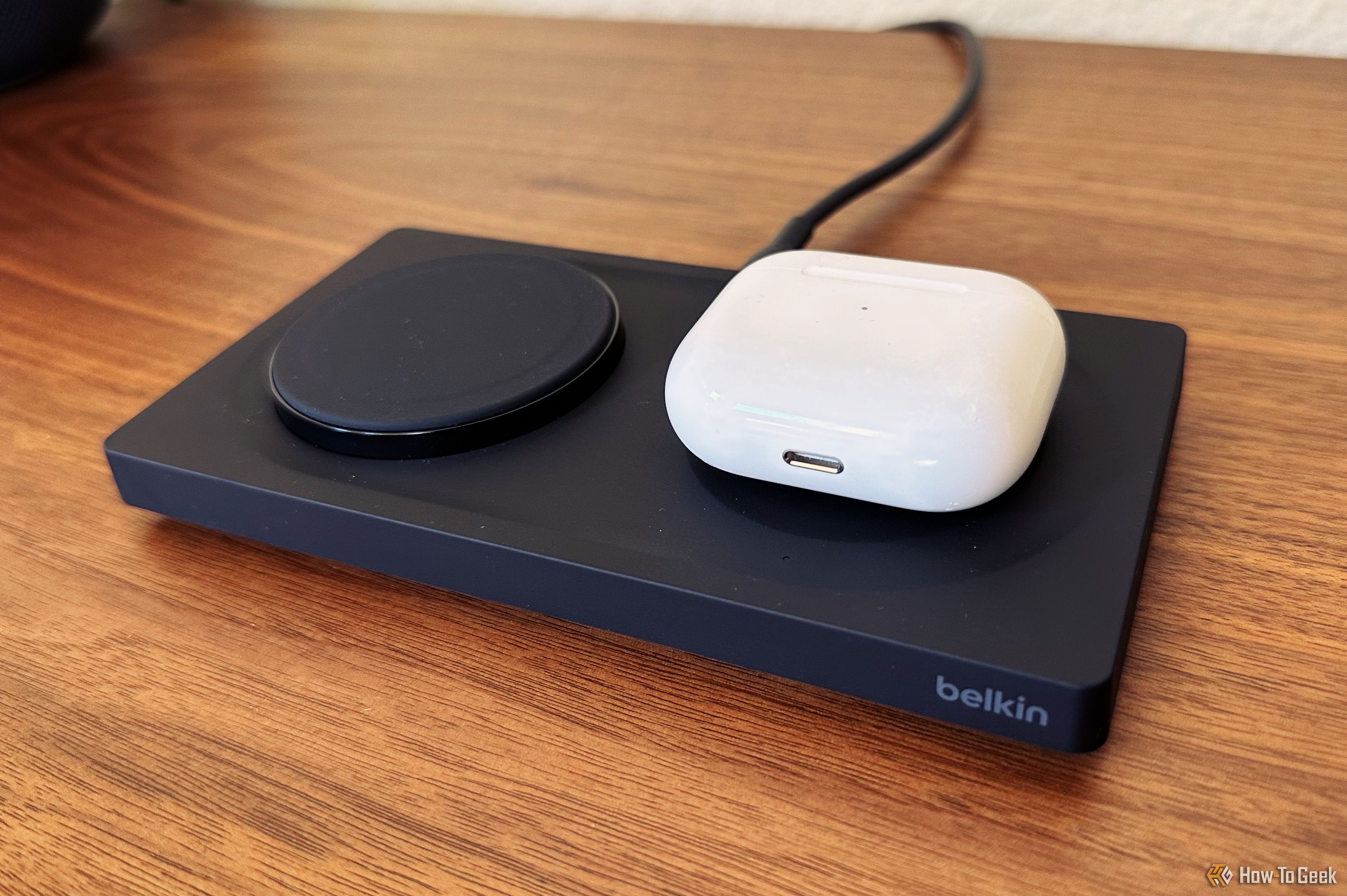 Belkin BoostCharge Pro 2-in-1 in black charging AirPods