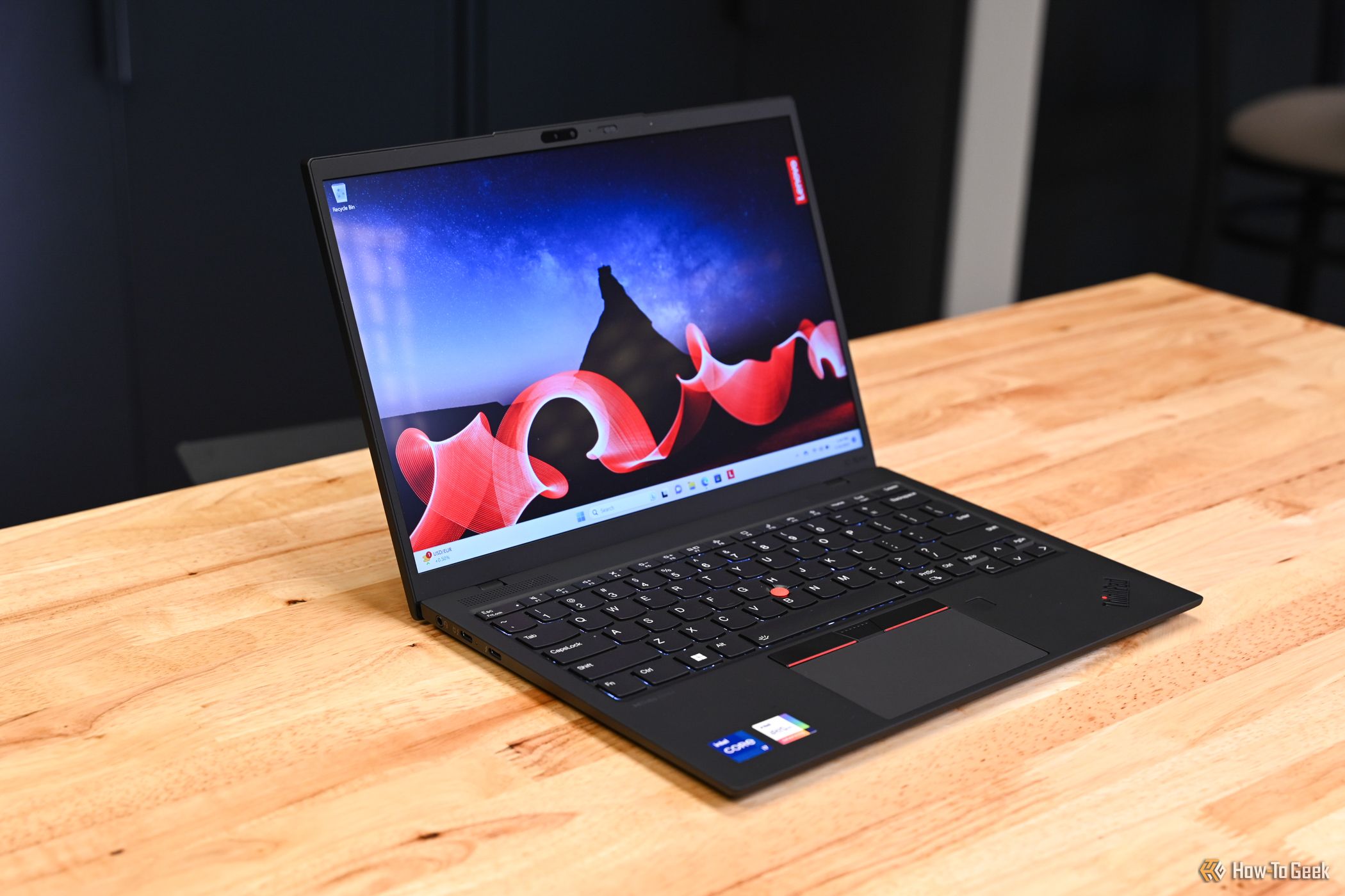 The Lenovo ThinkPad X1 Nano Gen 3 laptop open on a workbench.