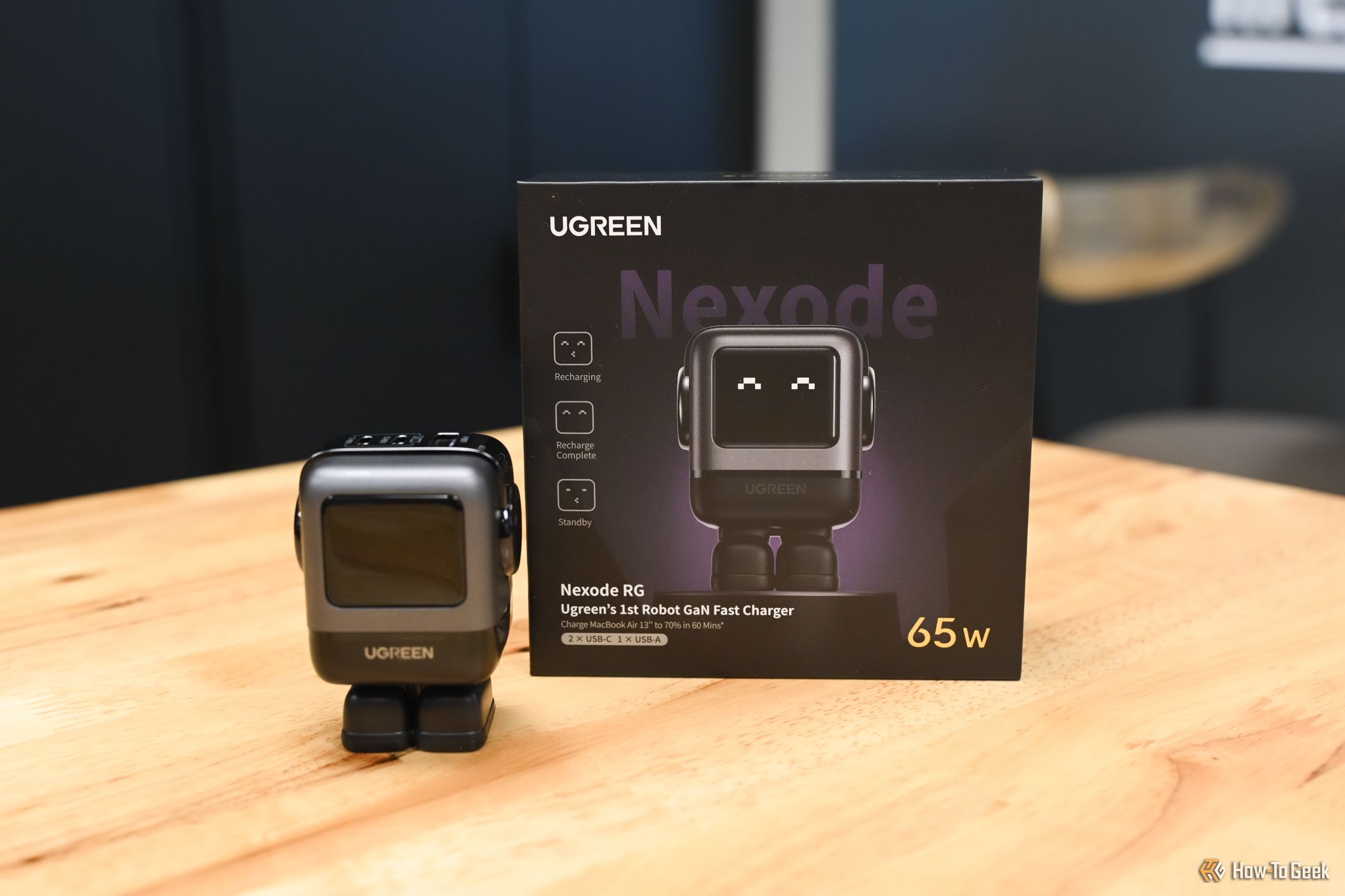 Ugreen Nexode 65W Robot Charger sitting next to packaging