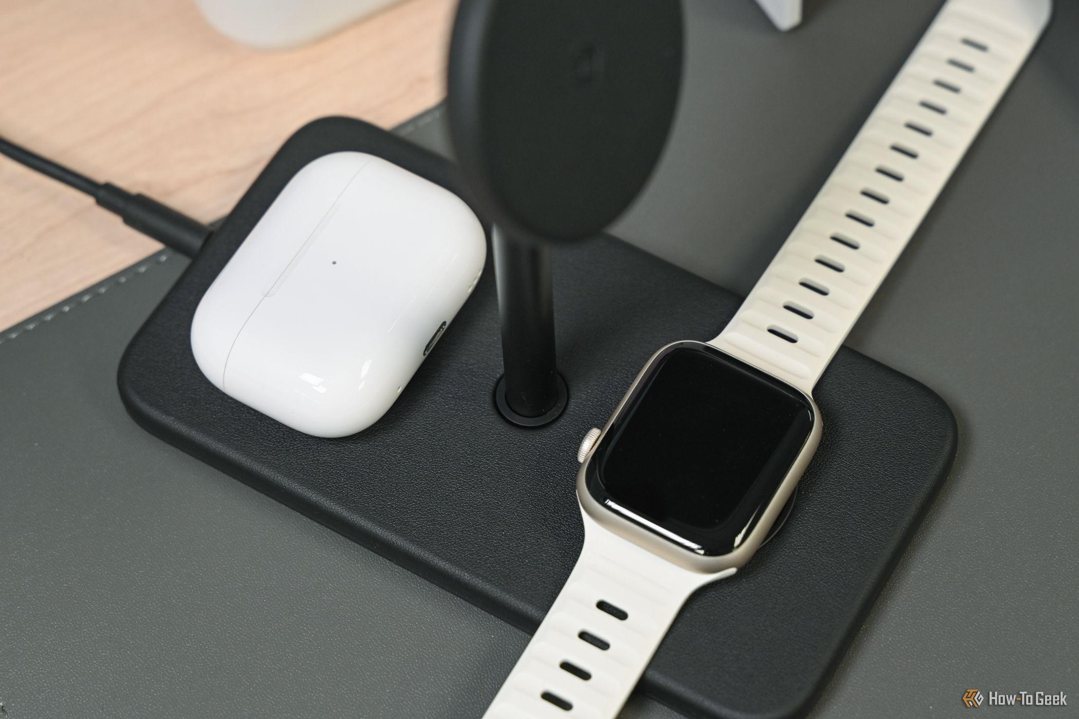 Twelve South HiRise 3 Deluxe on a desk with AirPods and Apple Watch charging