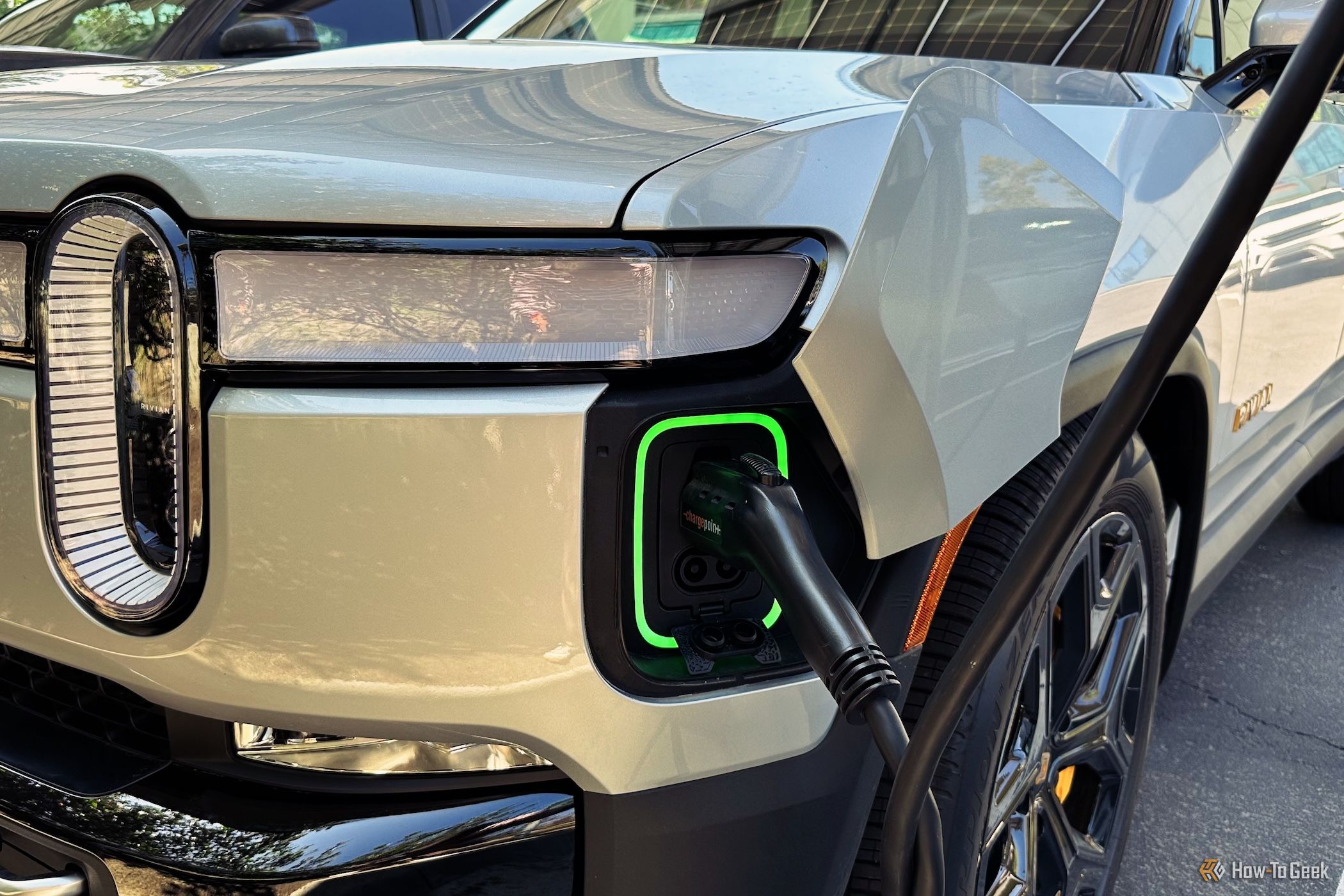 Rivian R1S plugged into a charging cable
