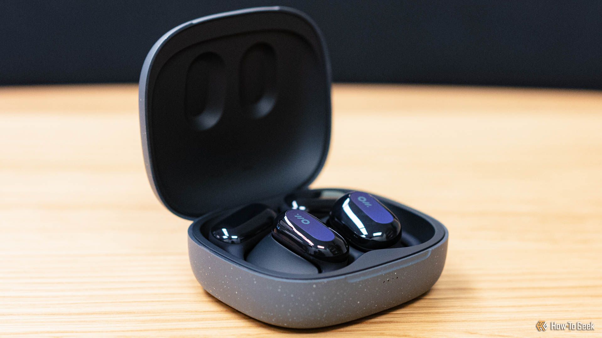 The Oladance Open-Ear Headphones in the charging case.