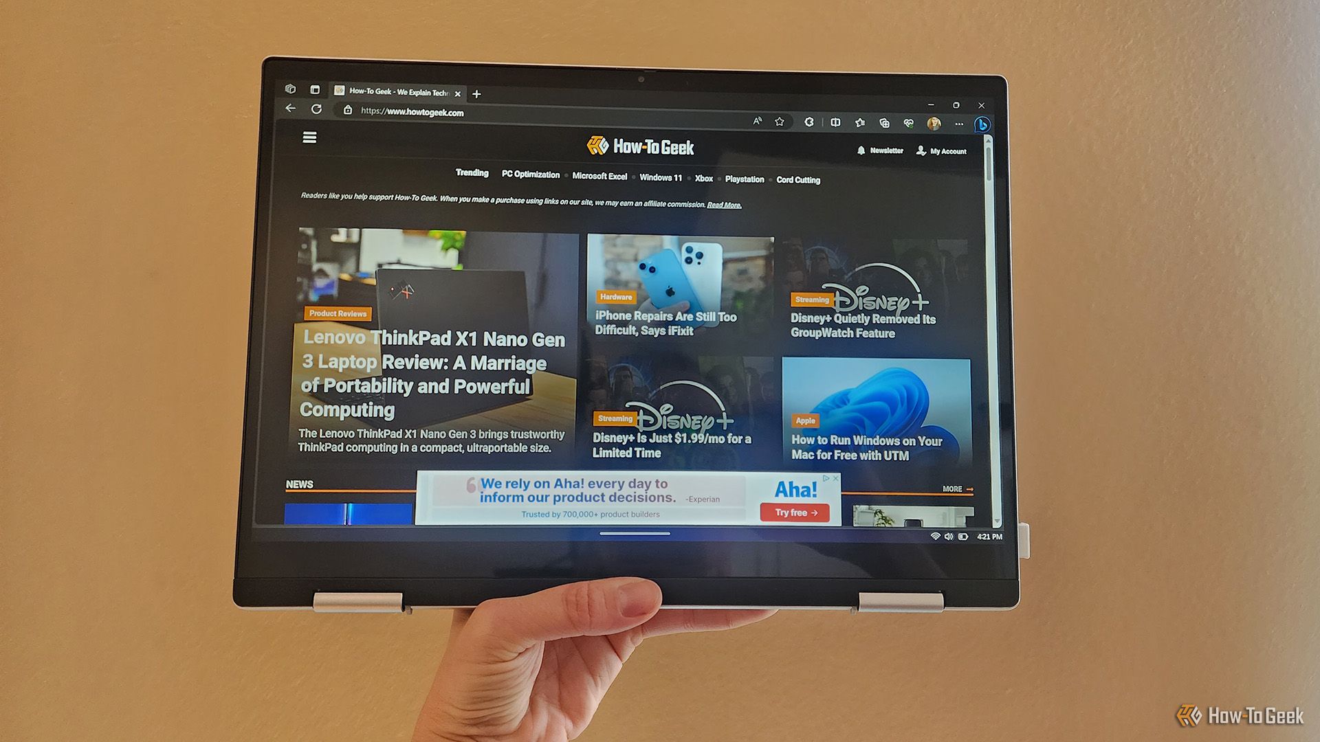 A person holding the Dell Inspiron 14 2-in-1 7435 laptop in tablet mode.