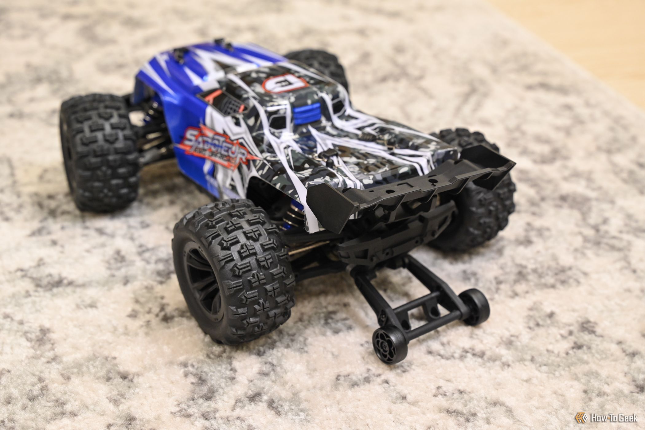 Deerc Brushless H16E RC car in blue with oversized tires