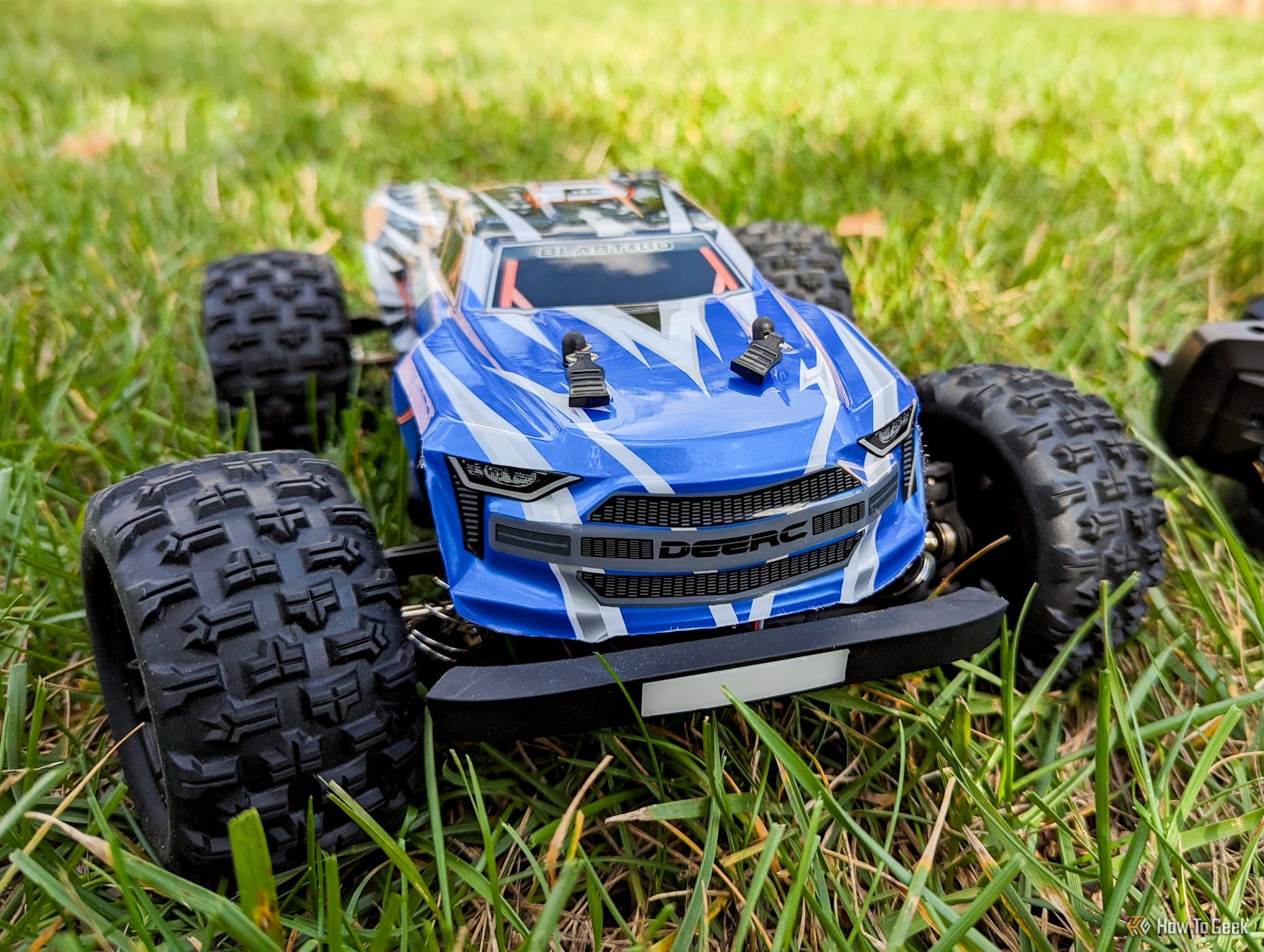 Deerc Brushless H16E RC car in the grass