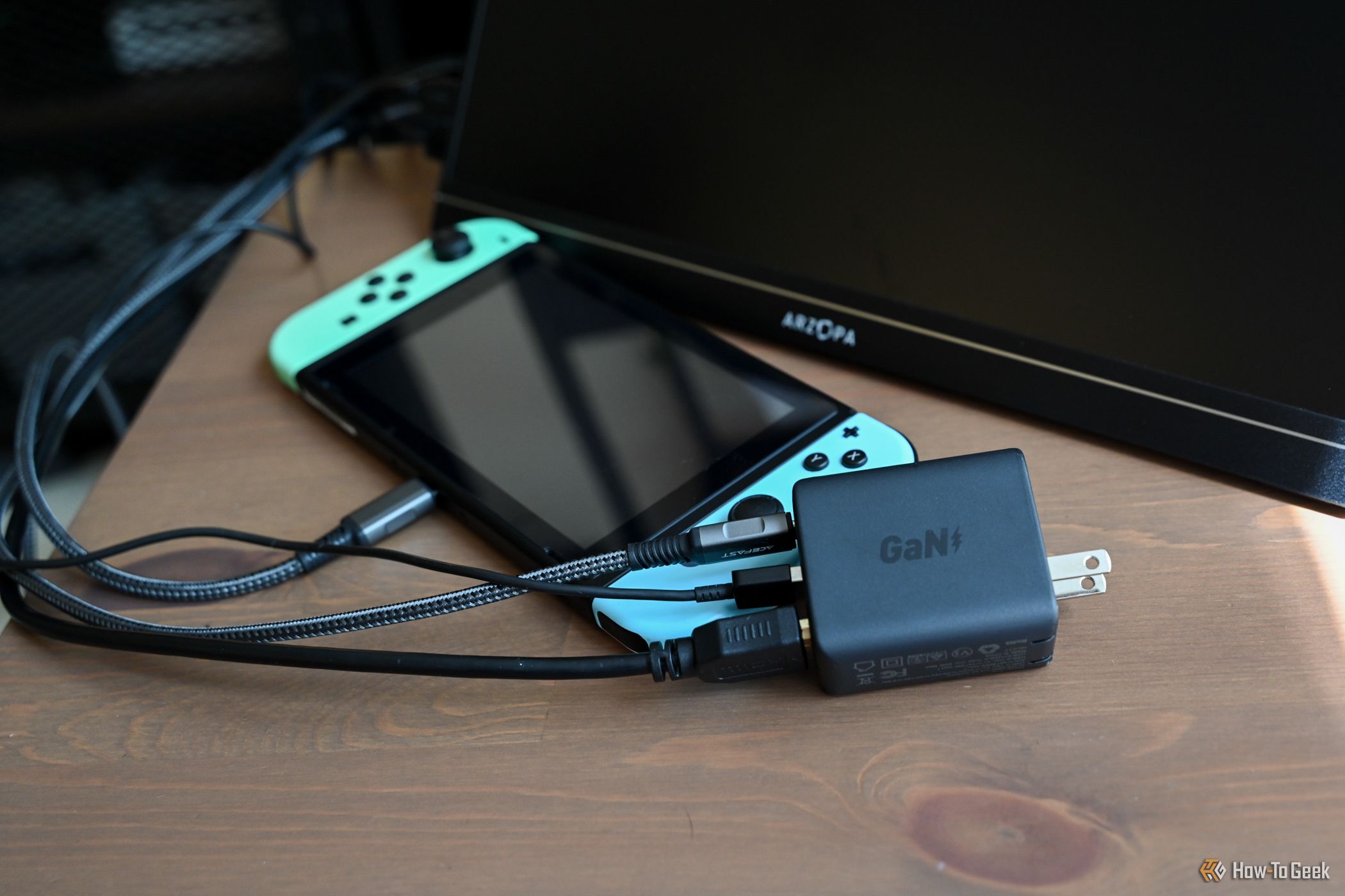 Cables plugged into the ACEFAST GaN PD65W 3 Port Fast Charger Hub to use a Nintendo Switch