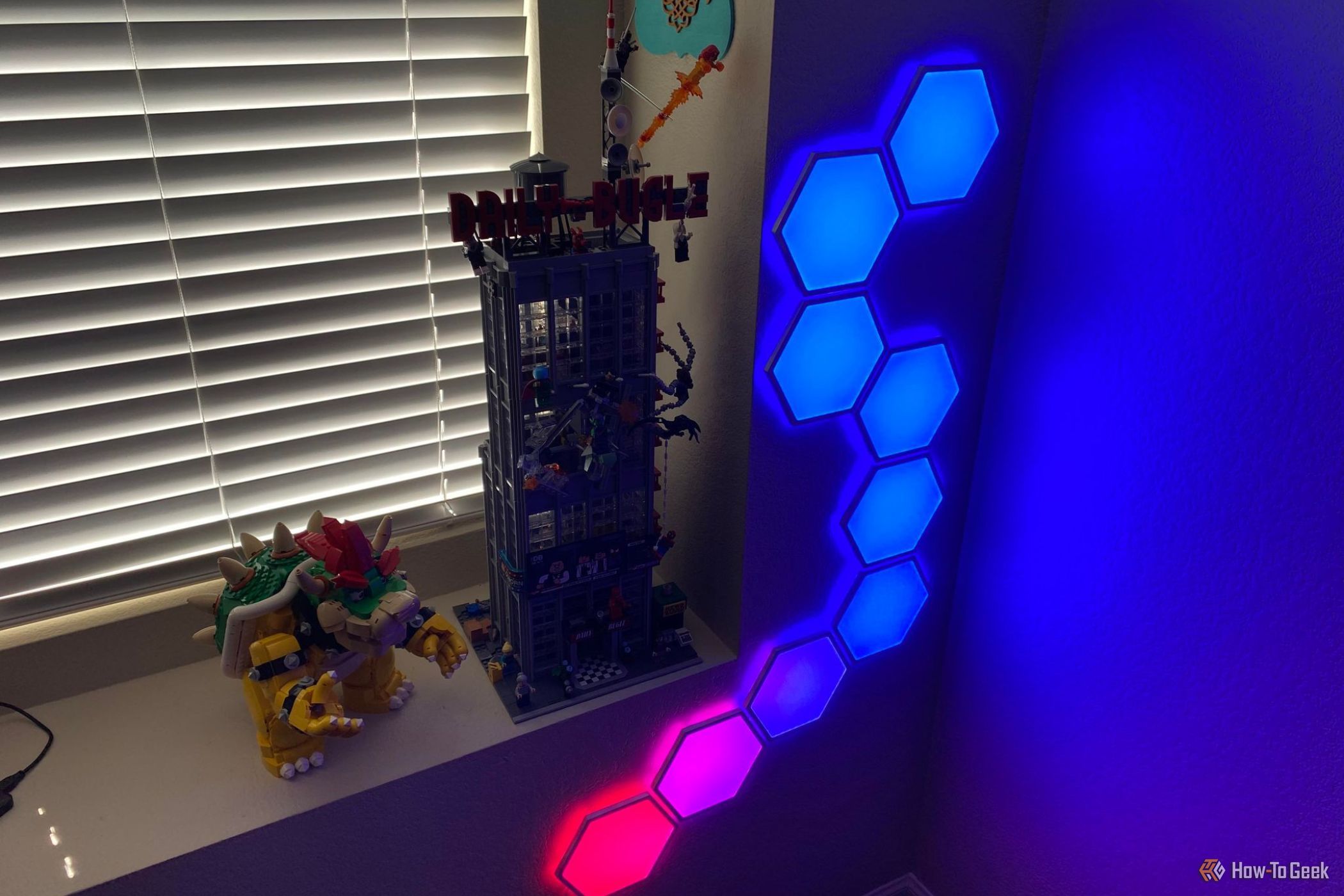 Cync Hexagon Light Kit showing blue and pink
