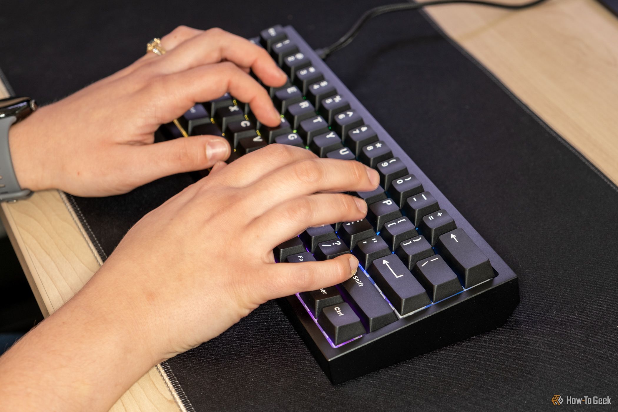 Person using the CyberPowerPC CK60 gaming keyboard