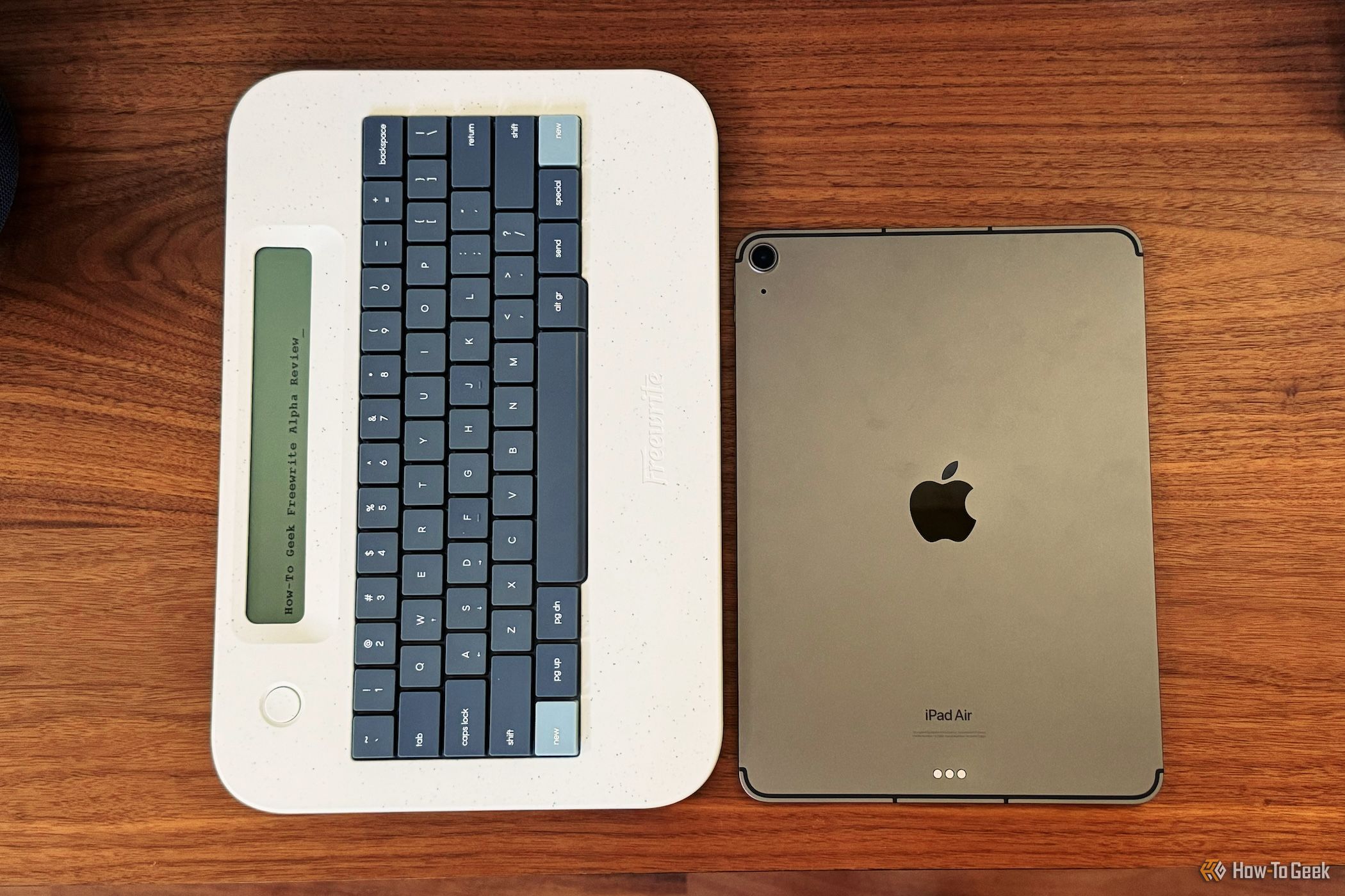 Freewrite Alpha on the left next to an iPad Air