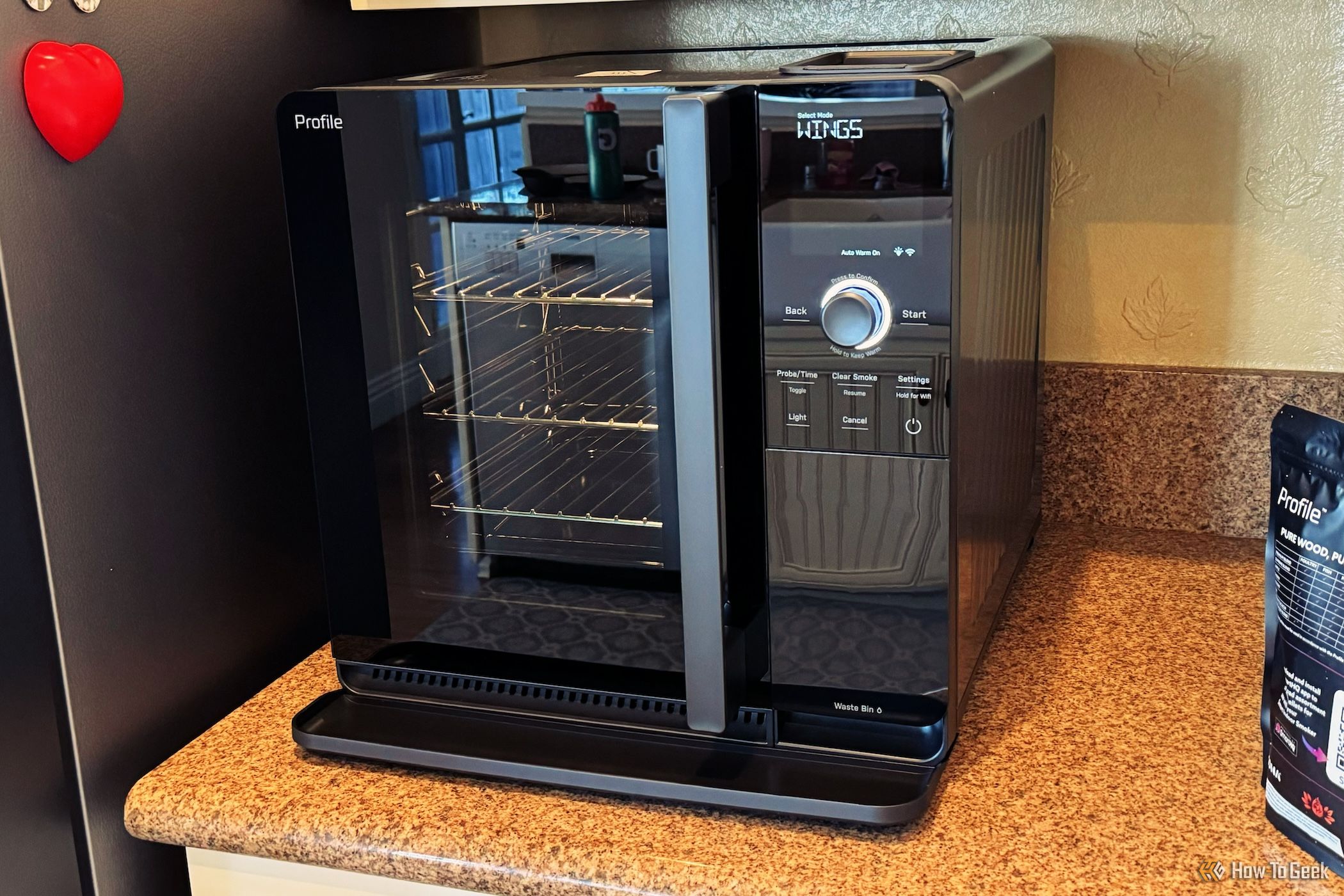 GE Profile Smart Indoor Smoker with the door closed on a counter