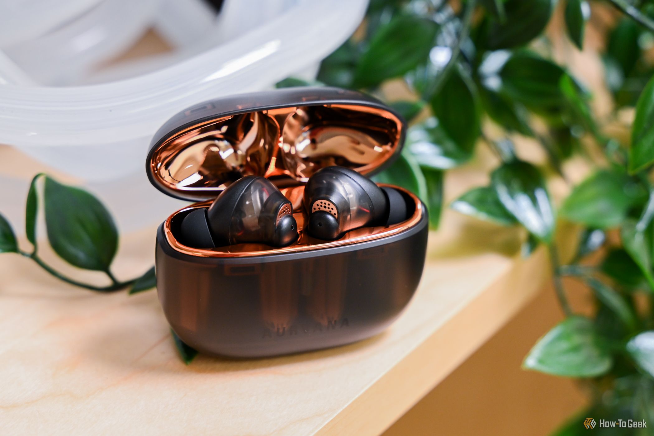 The Creative Aurvana Ace 2 earbuds in their open case