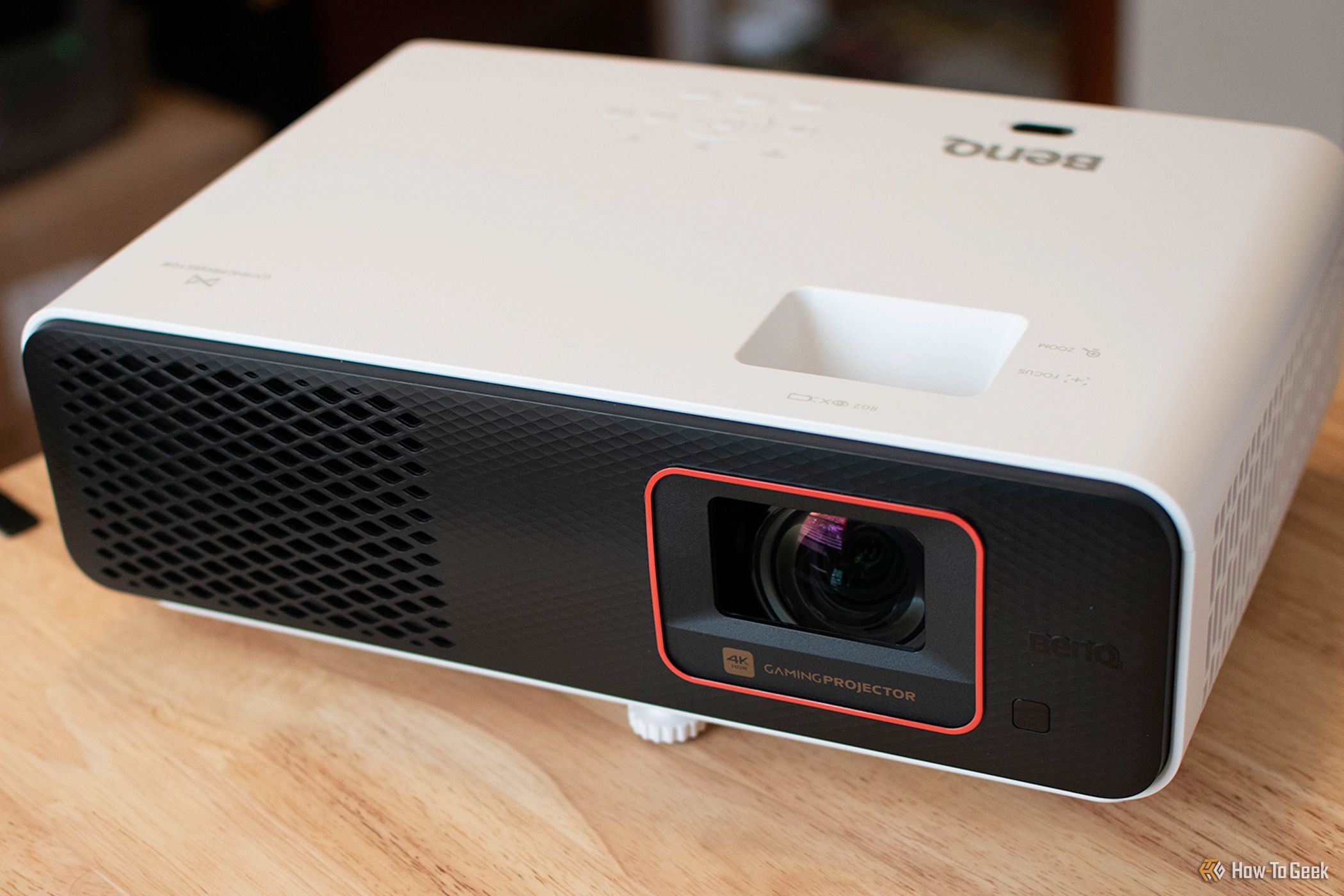 The BenQ X500i Projector on a table.
