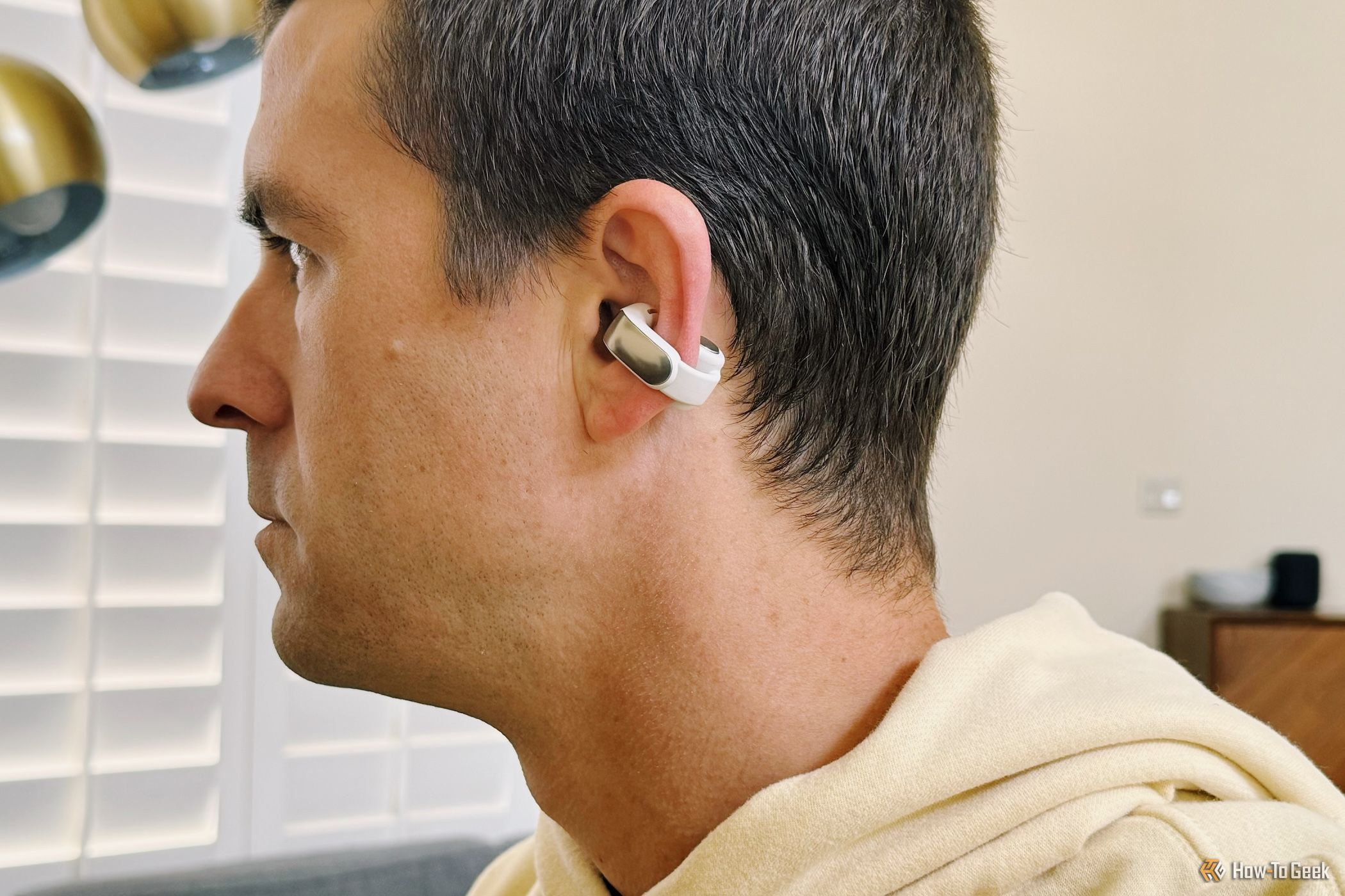 person wearing Bose Ultra Open Earbuds looking forward