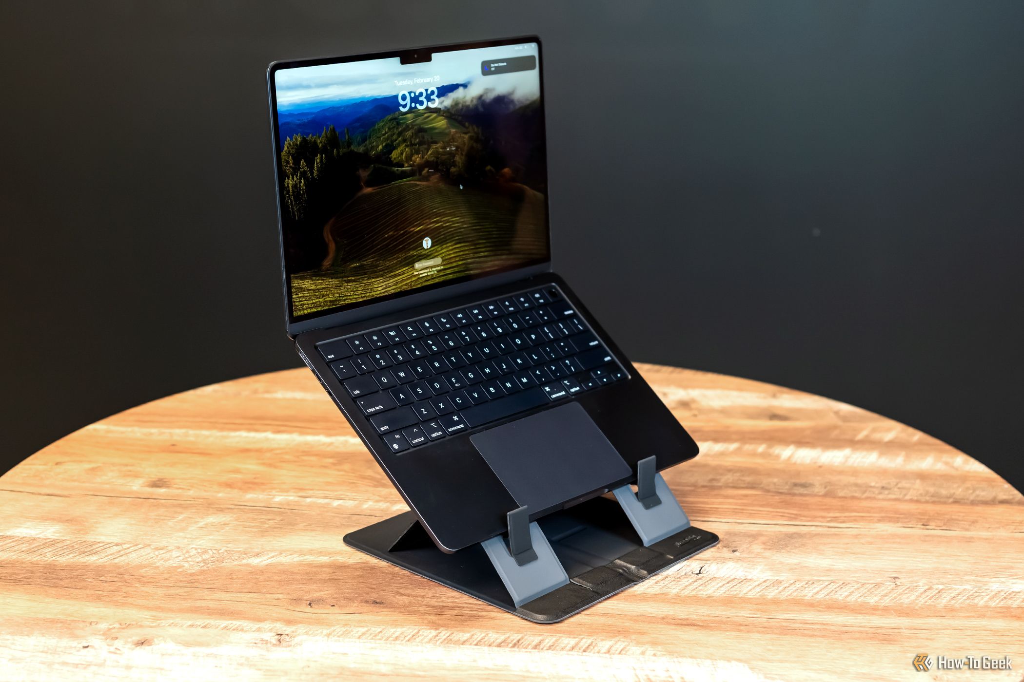 A MacBook on the Plugable PT-STANDX Foldable Stand