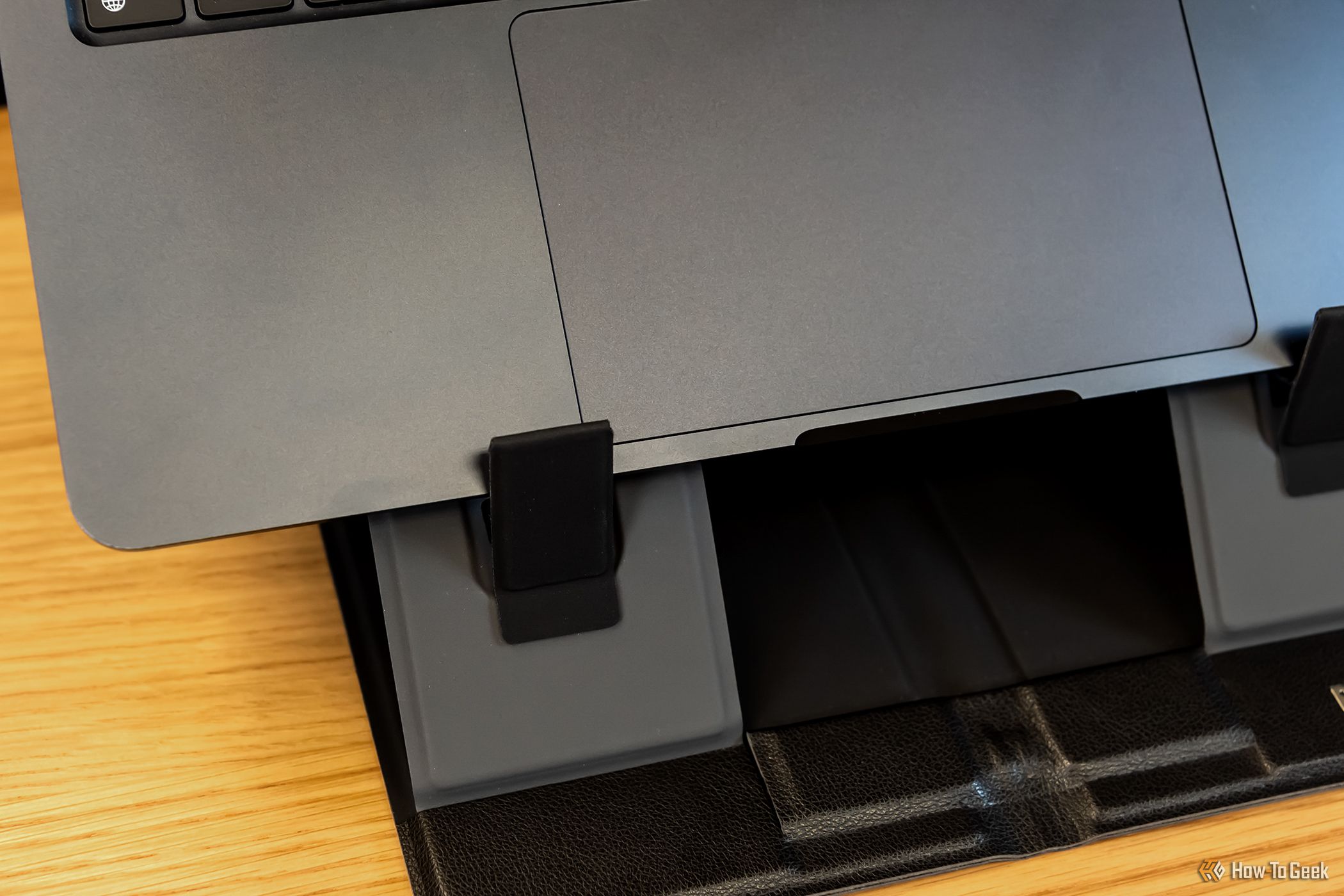 Close up of the tabs to hold on the Plugable PT-STANDX Foldable Stand