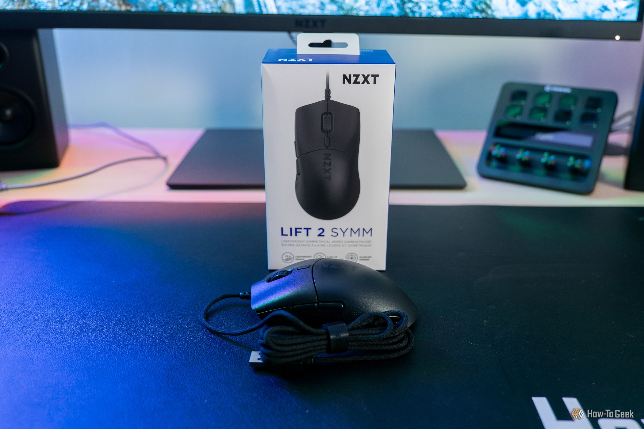 NZXT Lift 2 Symm mouse in front of box