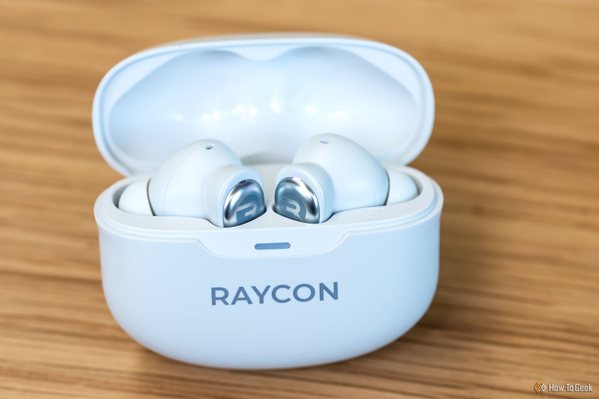 A pair of Raycon Everyday Earbuds Pro in their case