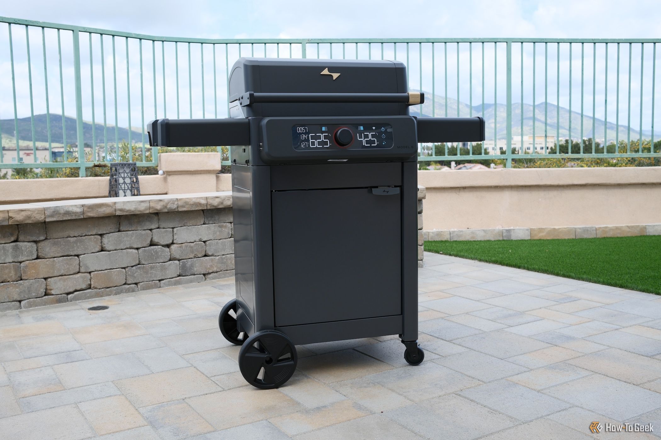 The front of the Current Model G Dual Zone Grill with the lid closed