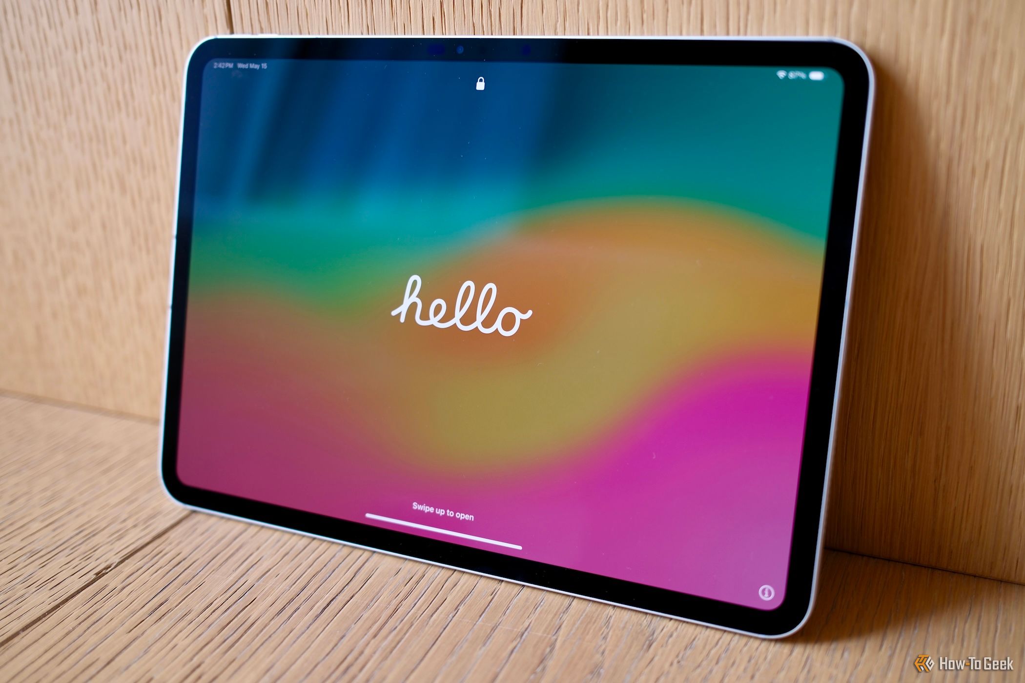 Apple iPad Pro (M4) leaning against a wall with the word hello on the screen