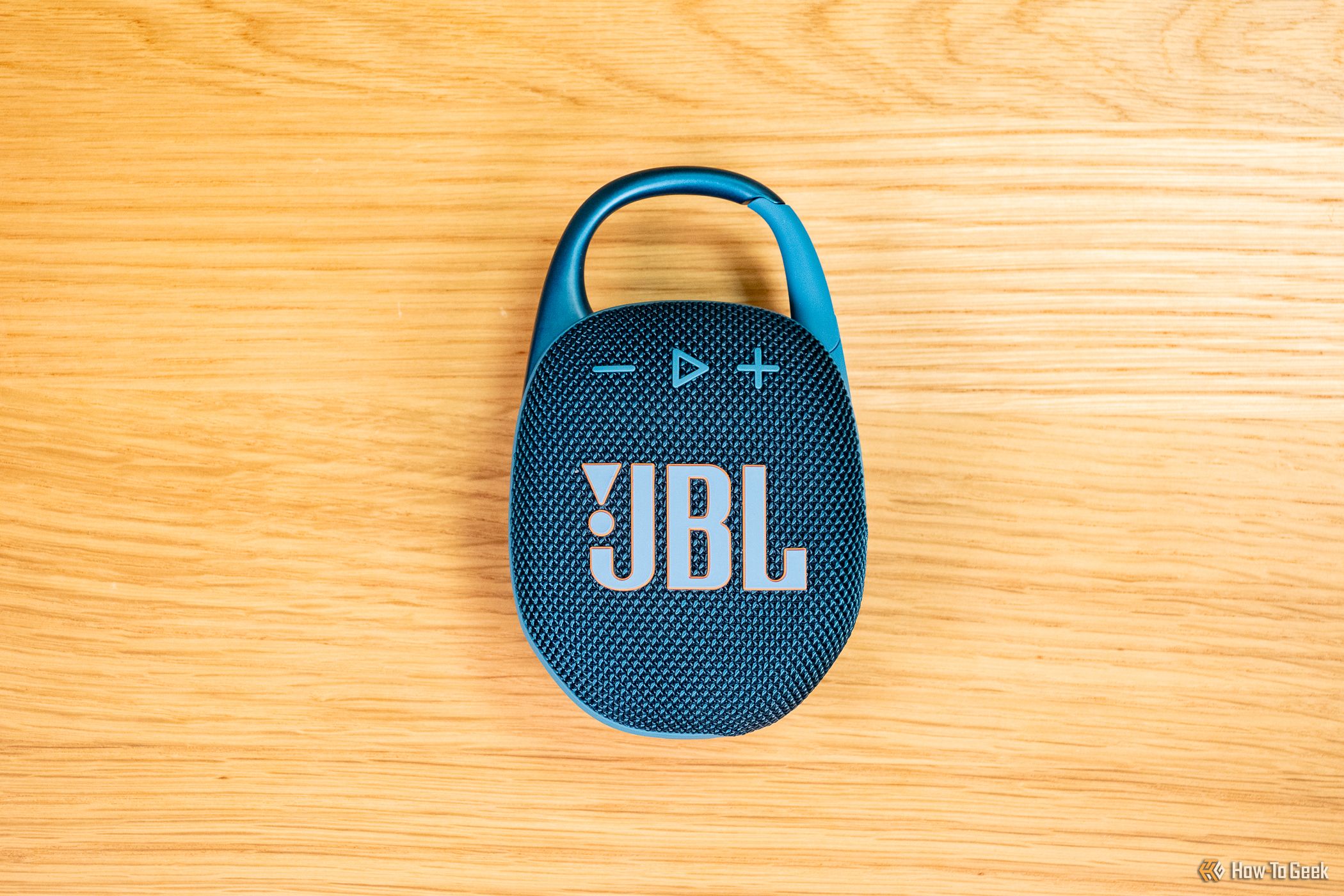 A top-down view of the JBL Clip 5 on a table.