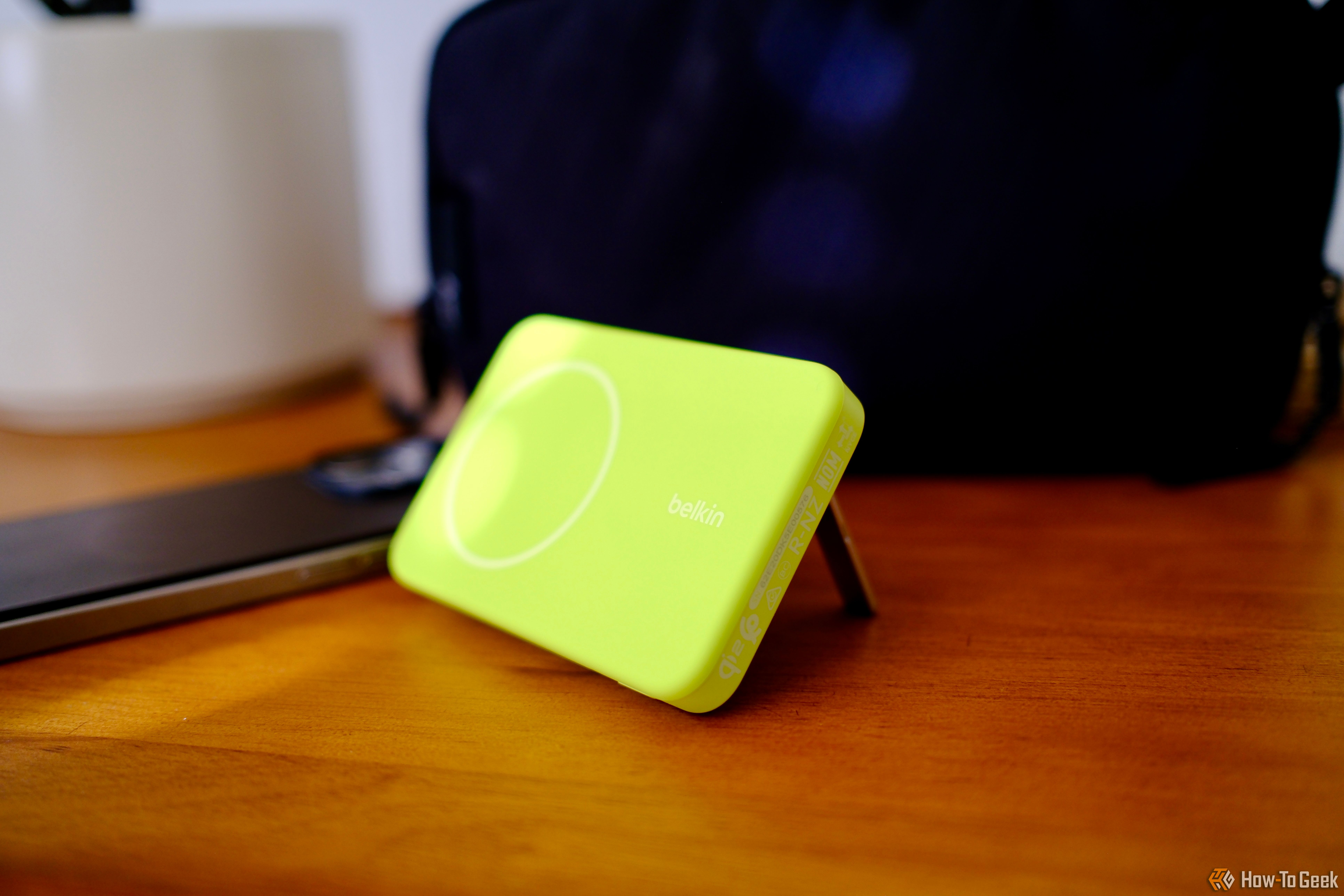 Belkin BoostCharge Pro Power Bank 5K laying sideways with kickstand