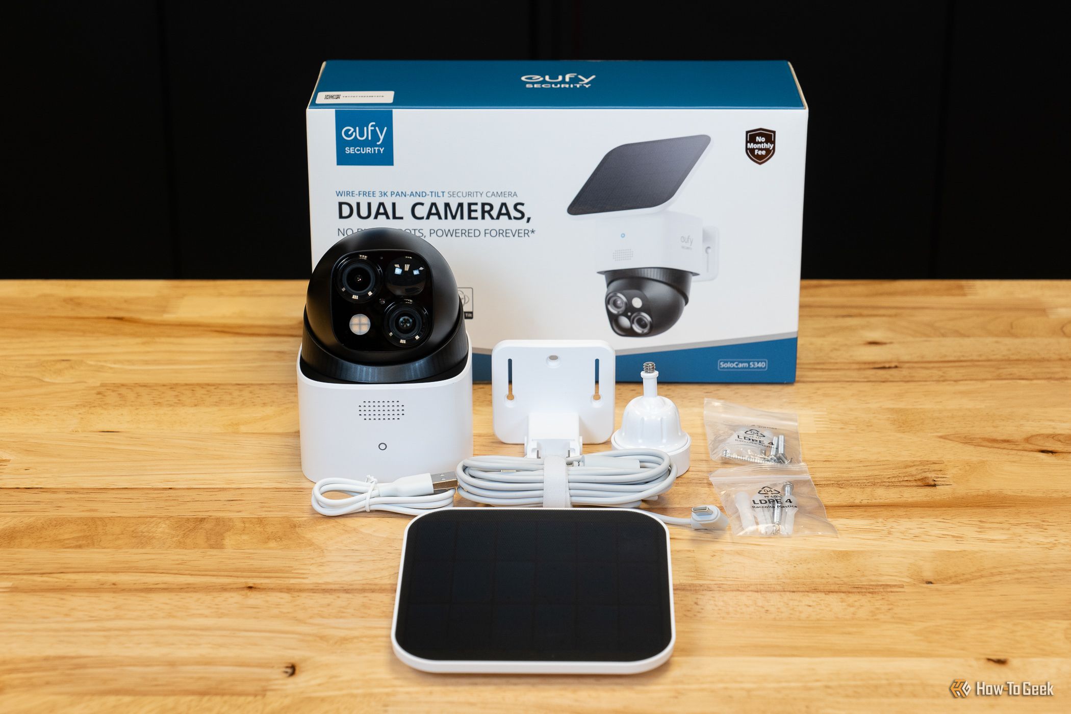 The Eufy Security SoloCam S340 with mounting plate, screws, and other accessories