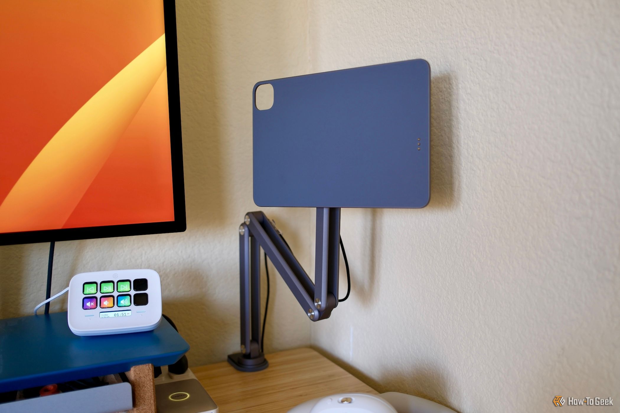Kuxiu X36 Pro Max iPad Stand clamped to a desk
