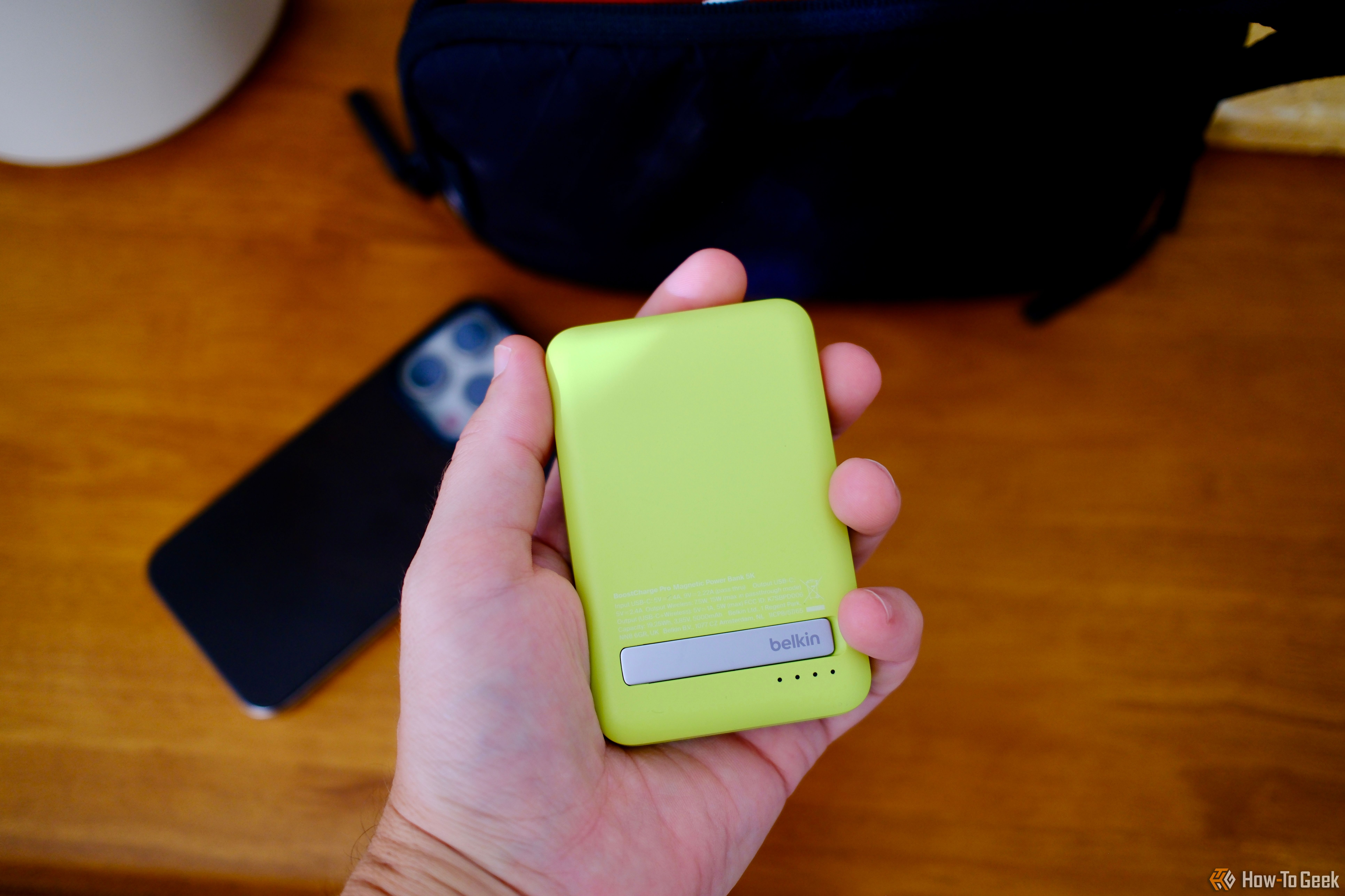 Person holding the Belkin BoostCharge Pro Power Bank 5K