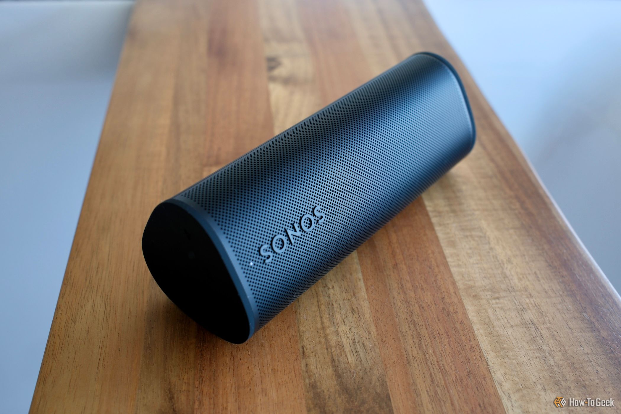 Sonos Roam 2 in black laying sideways.