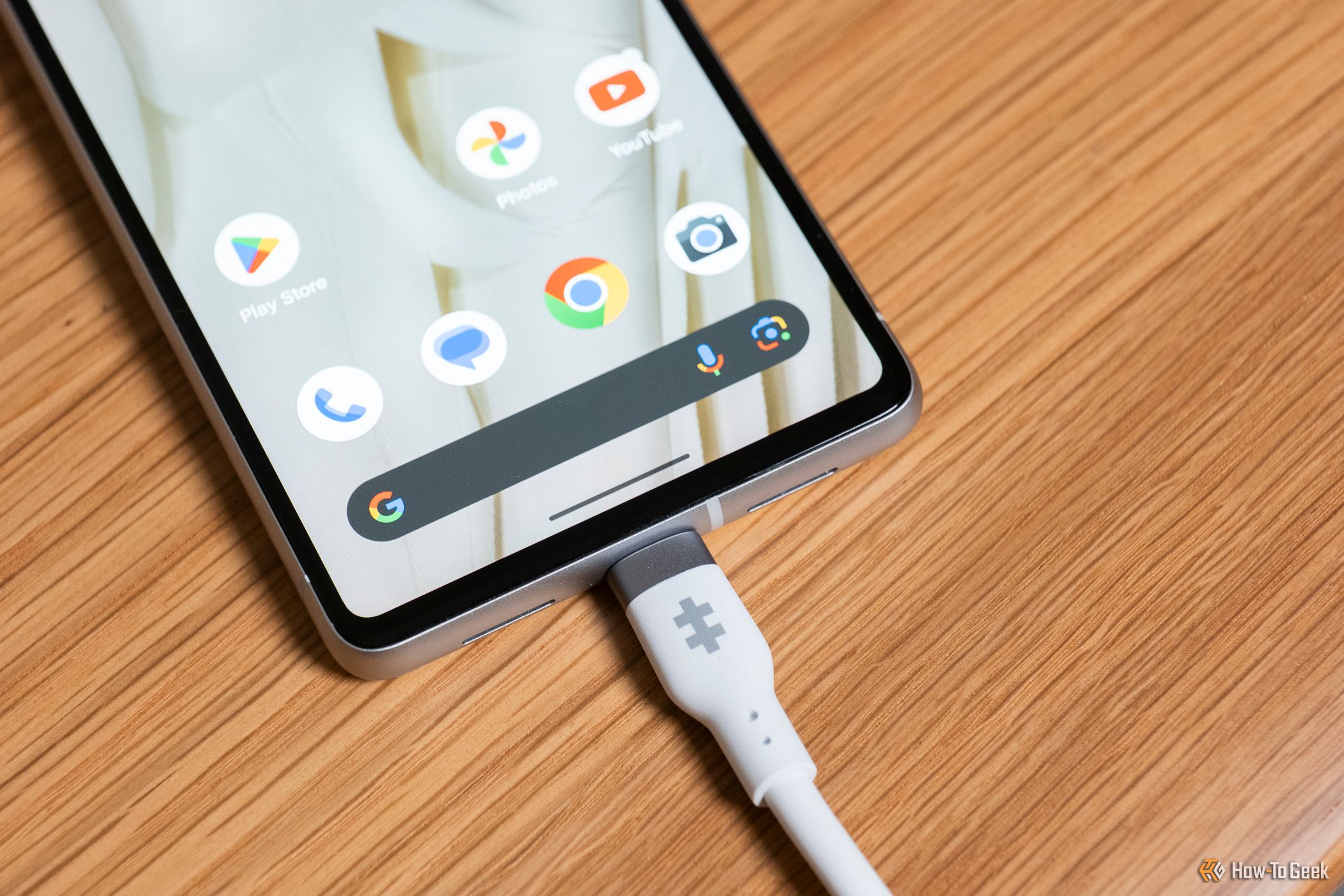 The Hyper HyperJuice 240W Silicone USB-C to USB-C Cable plugged in a phone