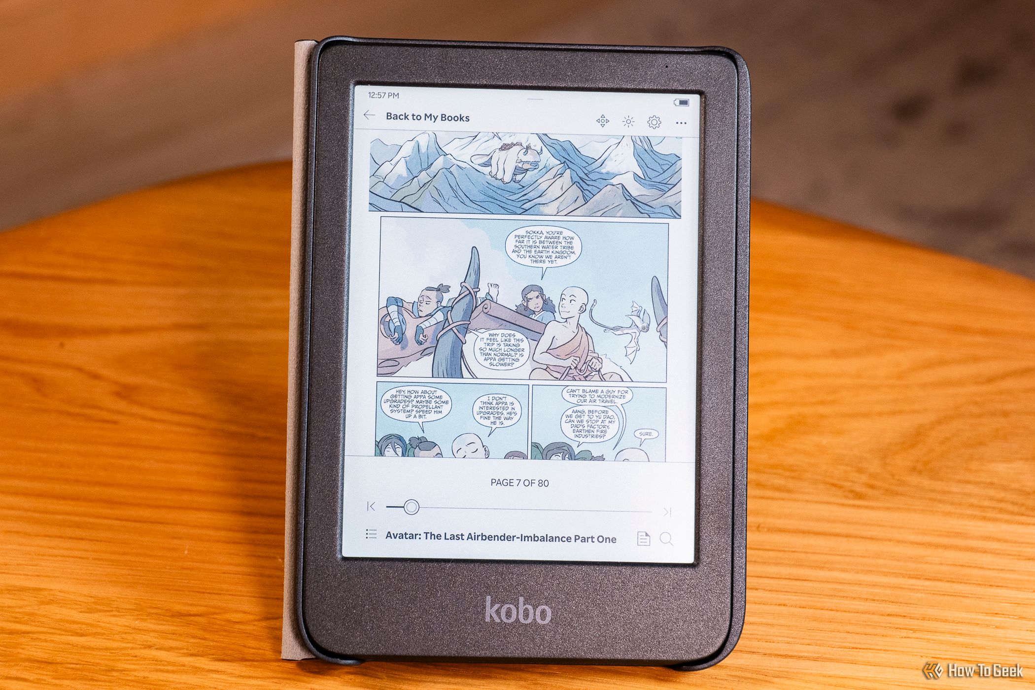 The Kobo Clara Colour with a book open.