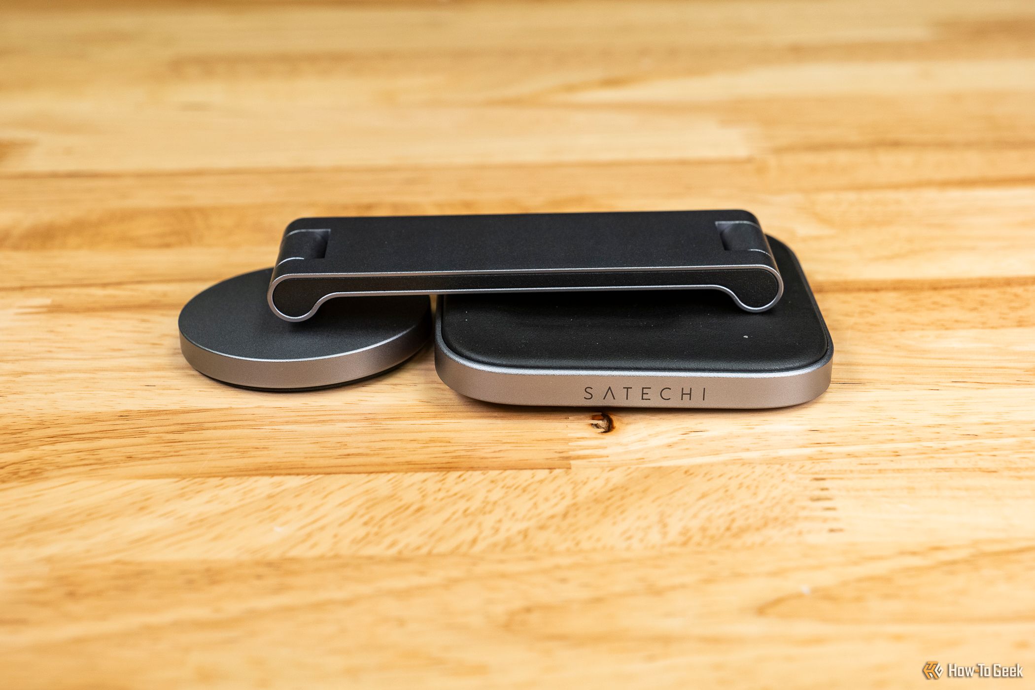 Satechi 2-in-1 Foldable Qi2 Wireless Charging Stand folded on a table