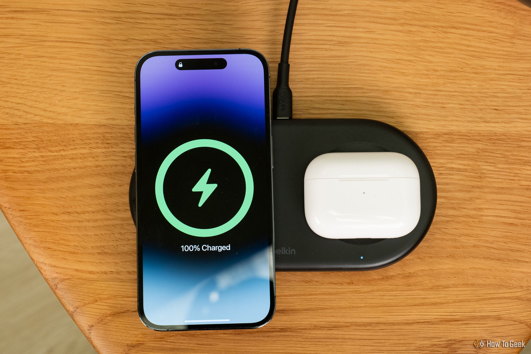 Belkin BoostCharge Pro 2-in-1 Magnetic Wireless Charging Pad with Qi2 with iPhone and AirPods from above