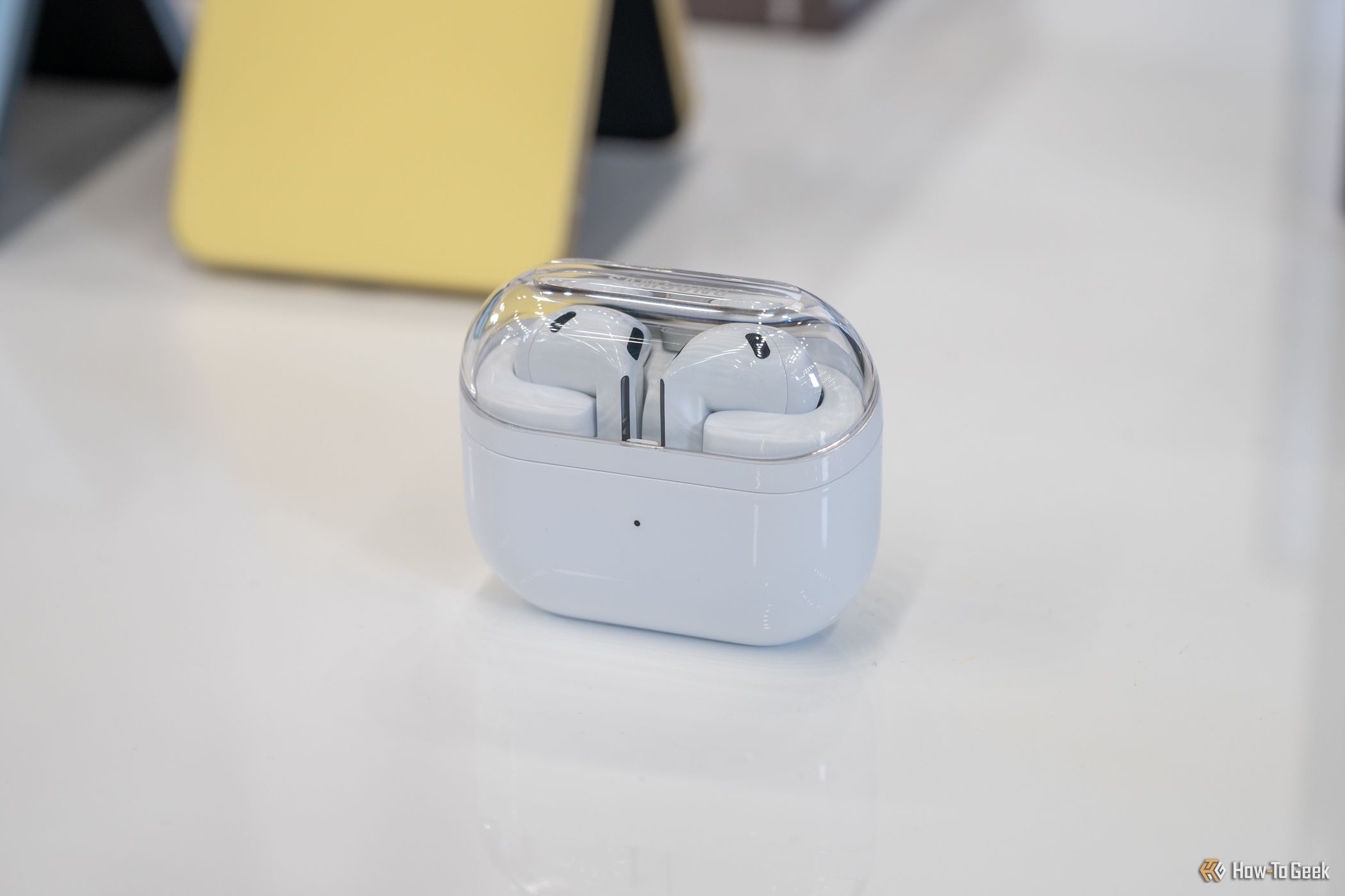 Samsung Galaxy Buds 3 sitting on a table inside its charging case