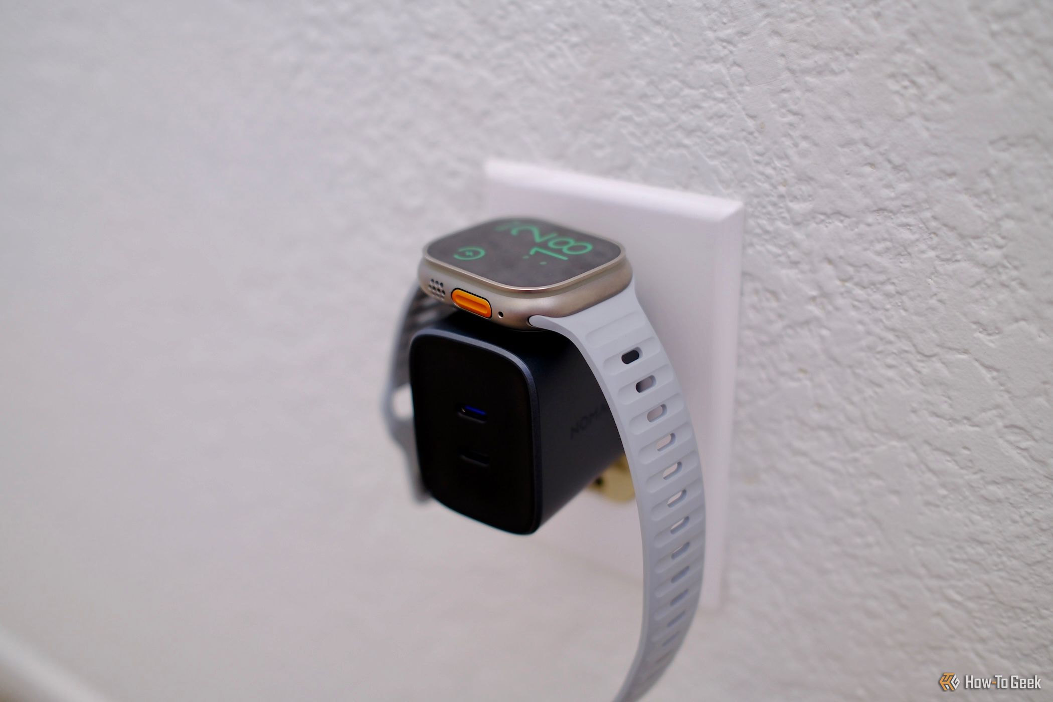 top view of Nomad 65W Power Adapter Watch Edition with watch charging