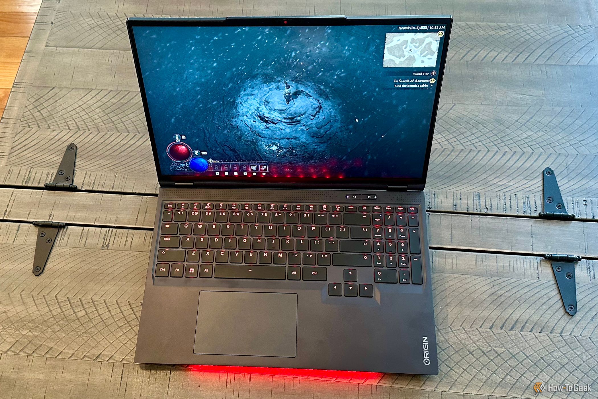 Origin PC EON16-X Laptop open on a table top running Diablo IV